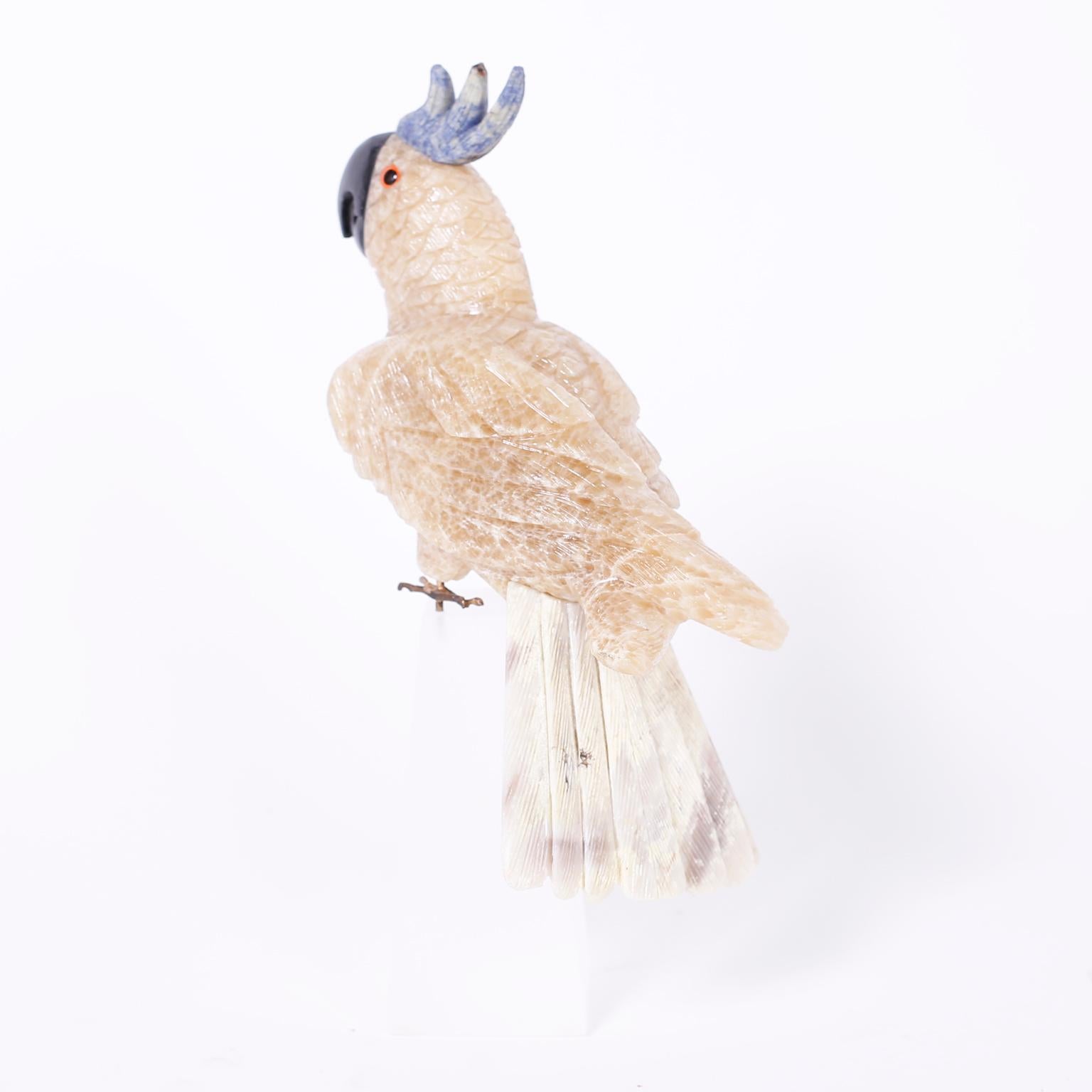 Carved Stone Parrot on a Frosted Lucite Base In Good Condition In Palm Beach, FL