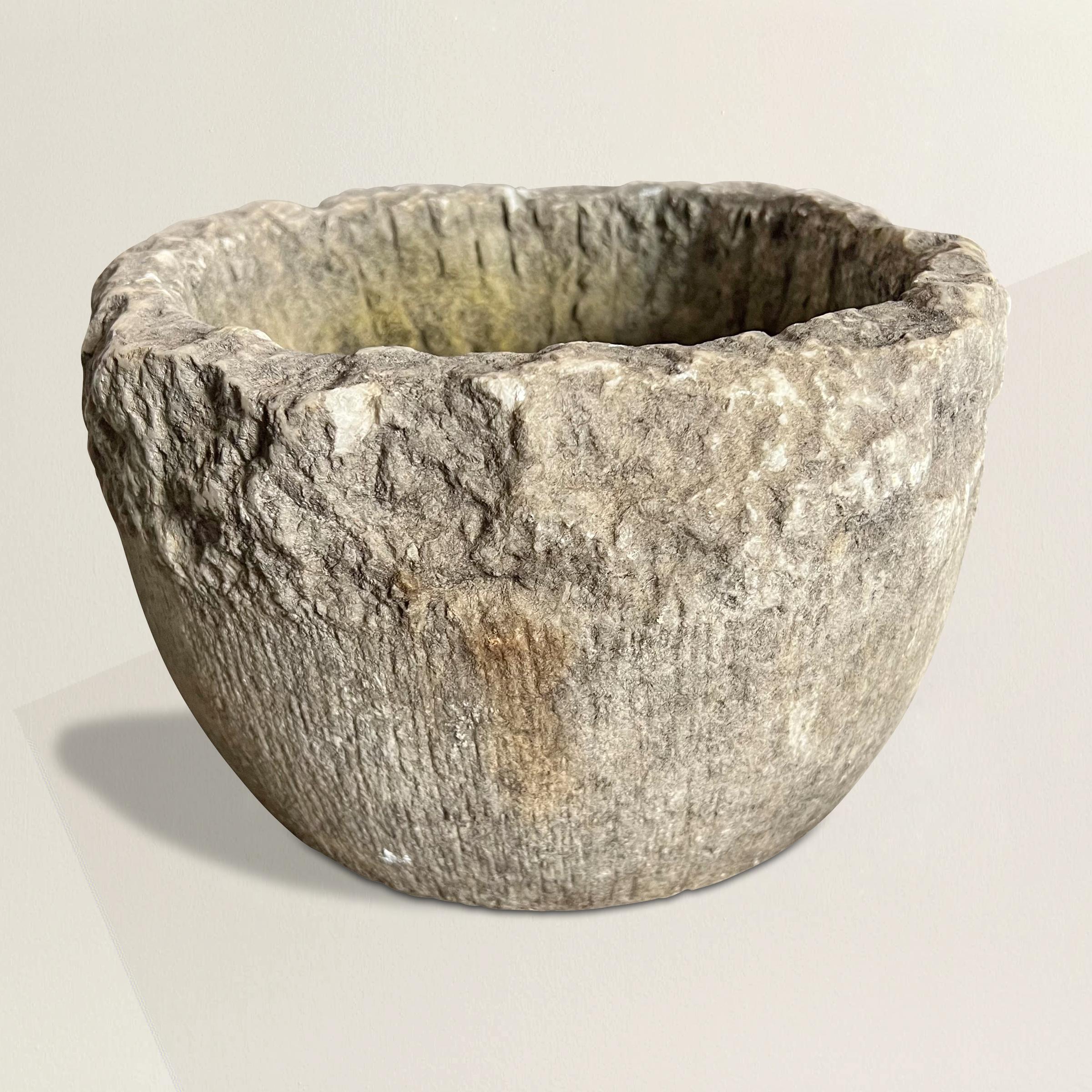 A simple yet chic 20th century hand-carved limestone planter with the most wonderful rough-hewn surface. Perfect for planting your favorite annuals or herbs to keep on your patio, or placed somewhere special in your garden.
