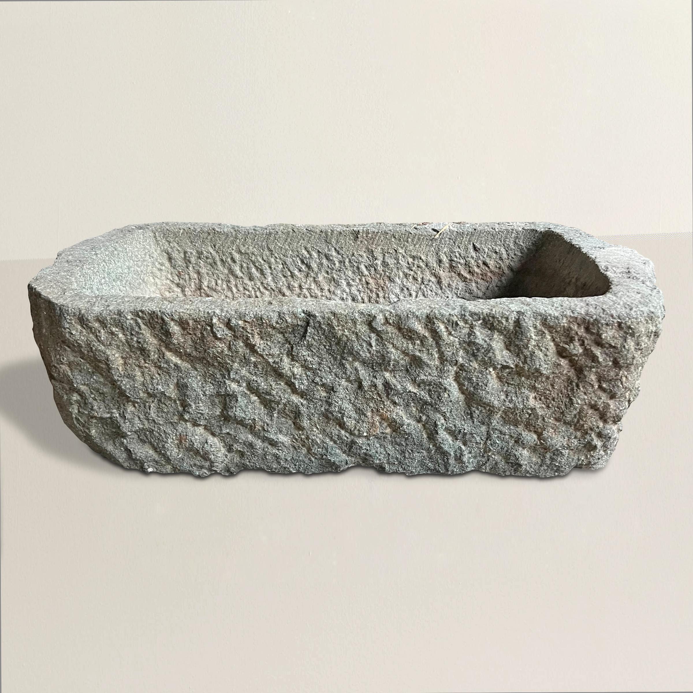 A simple yet chic 20th century hand-carved granite planter with the most wonderful rough-hewn surface. Perfect for planting your favorite annuals or herbs to keep on your patio, or placed somewhere special in your garden.