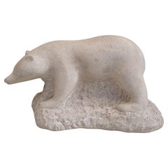 Carved stone sculpture of a polar bear, signed.