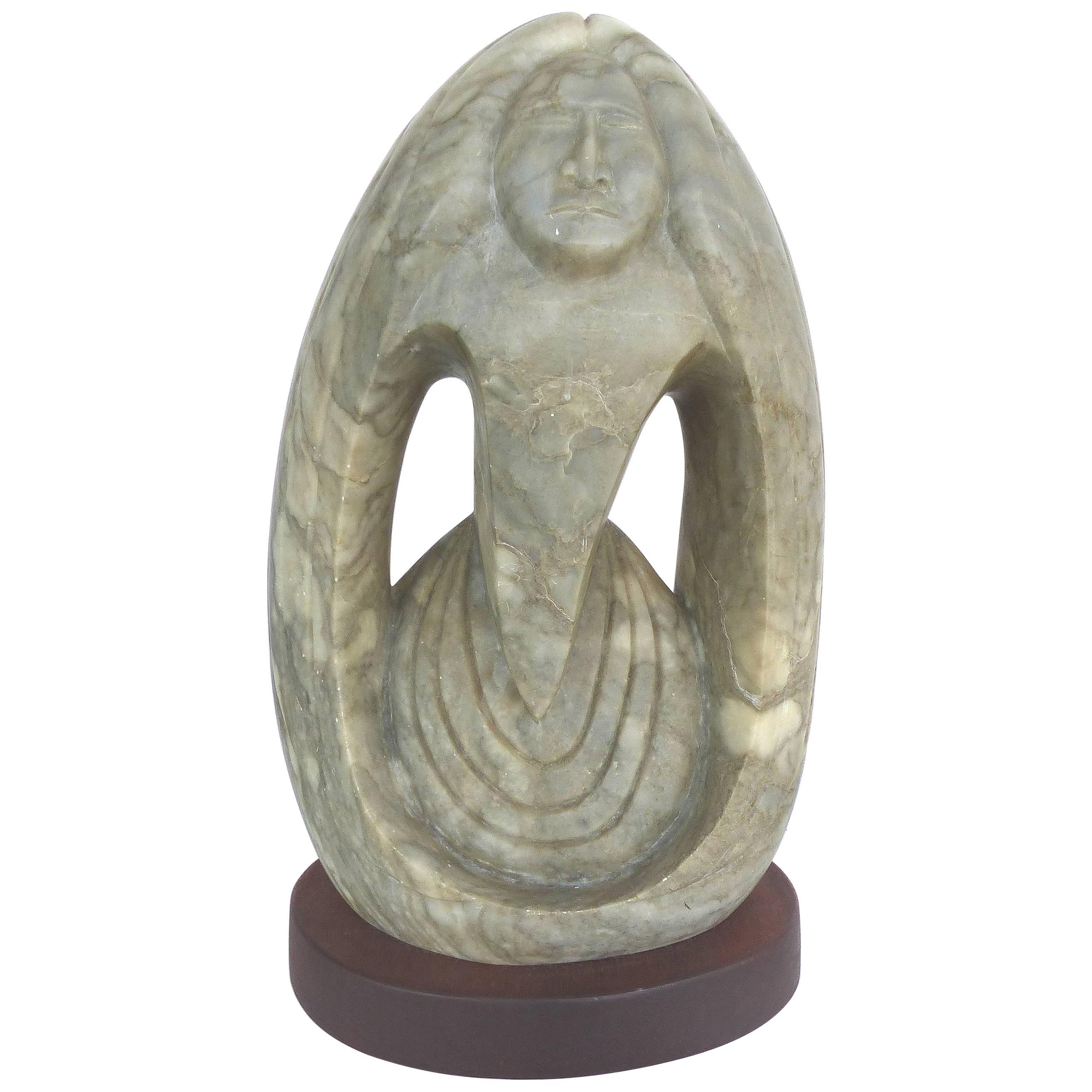 Carved Stone Sculpture of a Southwestern Figure of a Native Woman on Wood Base