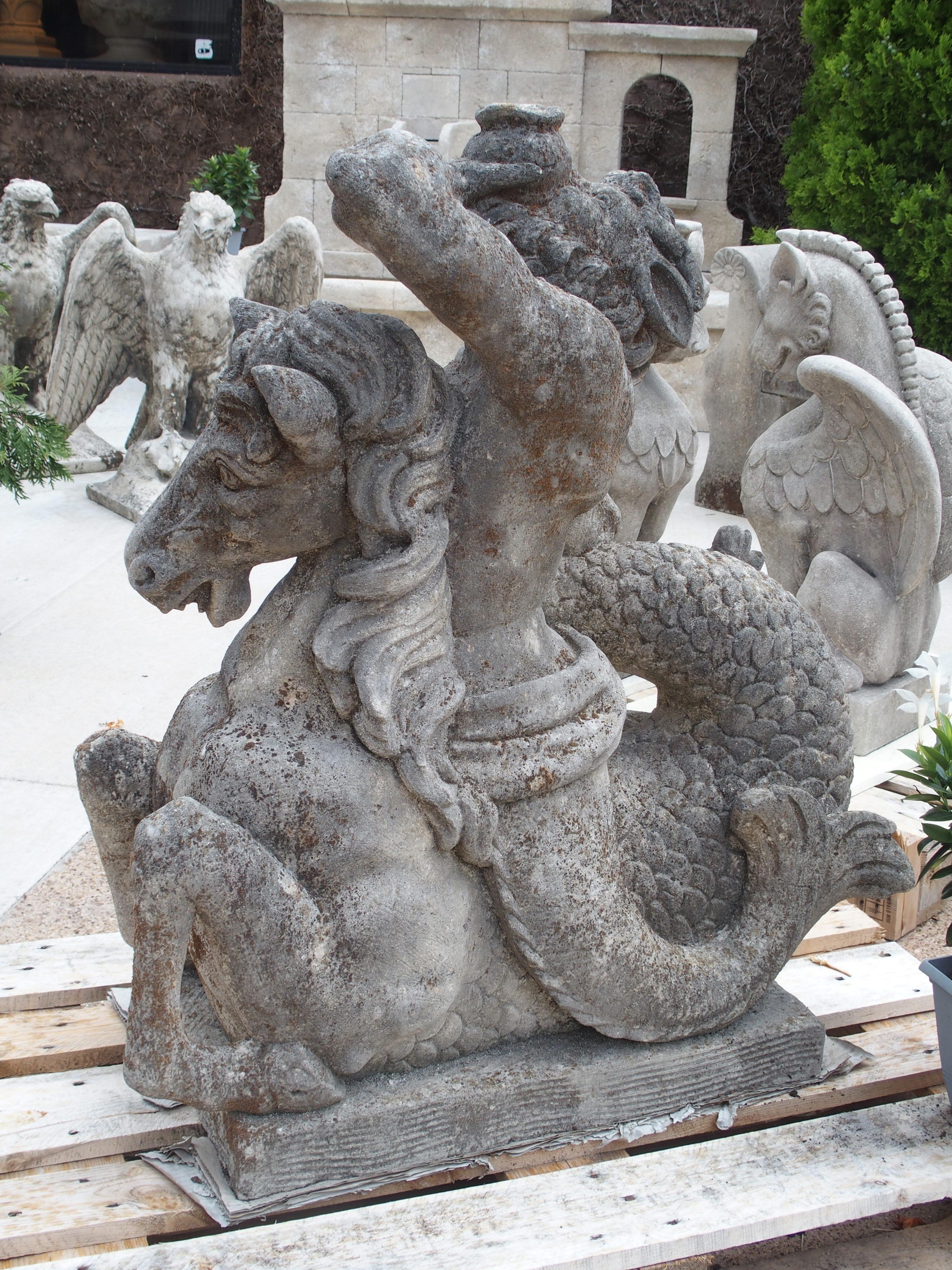 Hand-carved in Italy, this amazing limestone sculpture depicts Triton riding a seahorse. The sculpture sits on a rectangular plinth that is 2 ¾ inches thick (all carved from the same block of stone). The sides and top of the base have been patterned