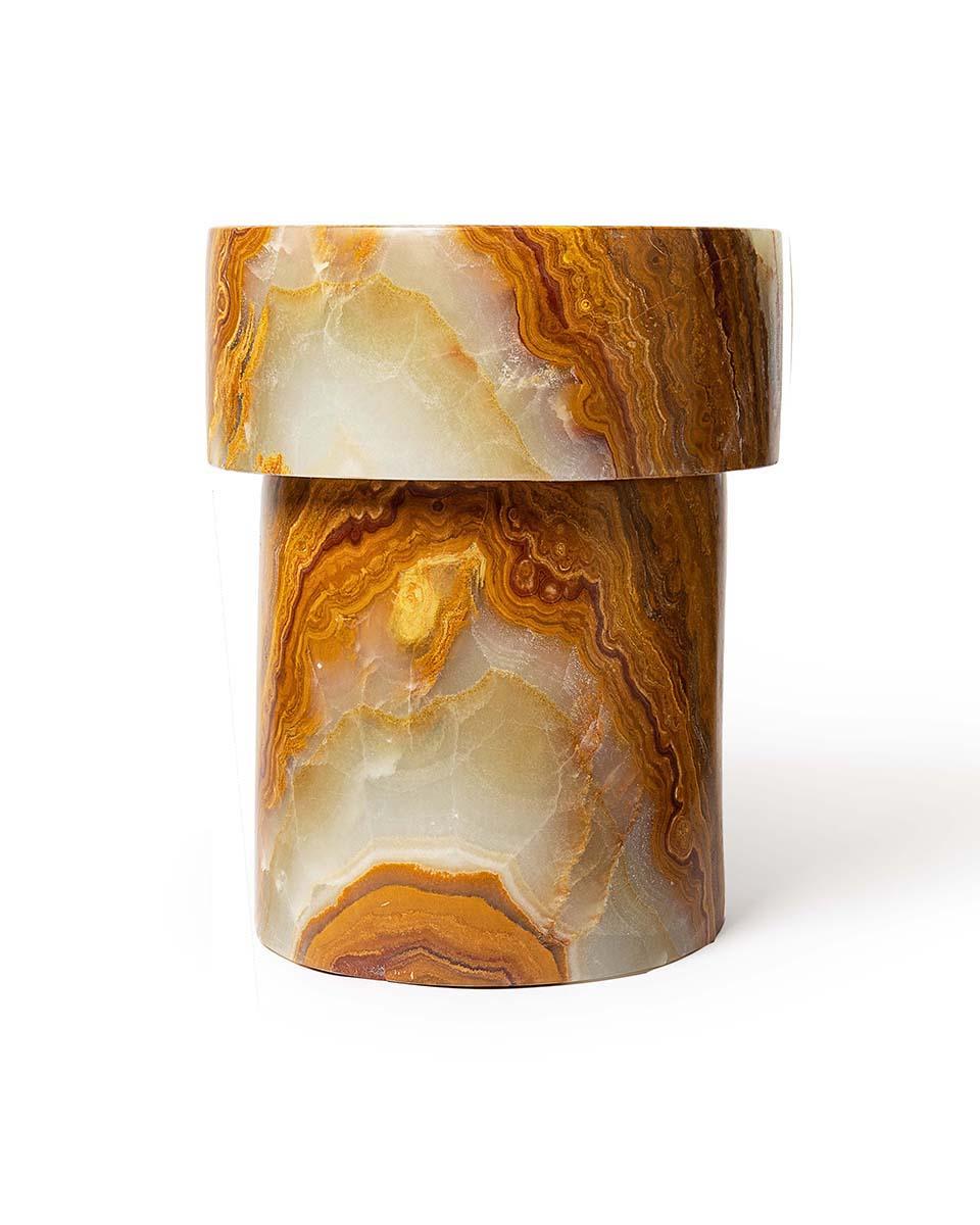 The Carved Stone Stool Series are combinations of either straight or tapered capitals and bases. Shape 1 is the first in the series of 4 shapes, with both a straight capital and base. Shown here in highly variegated Verde Onyx. Each stool is made to