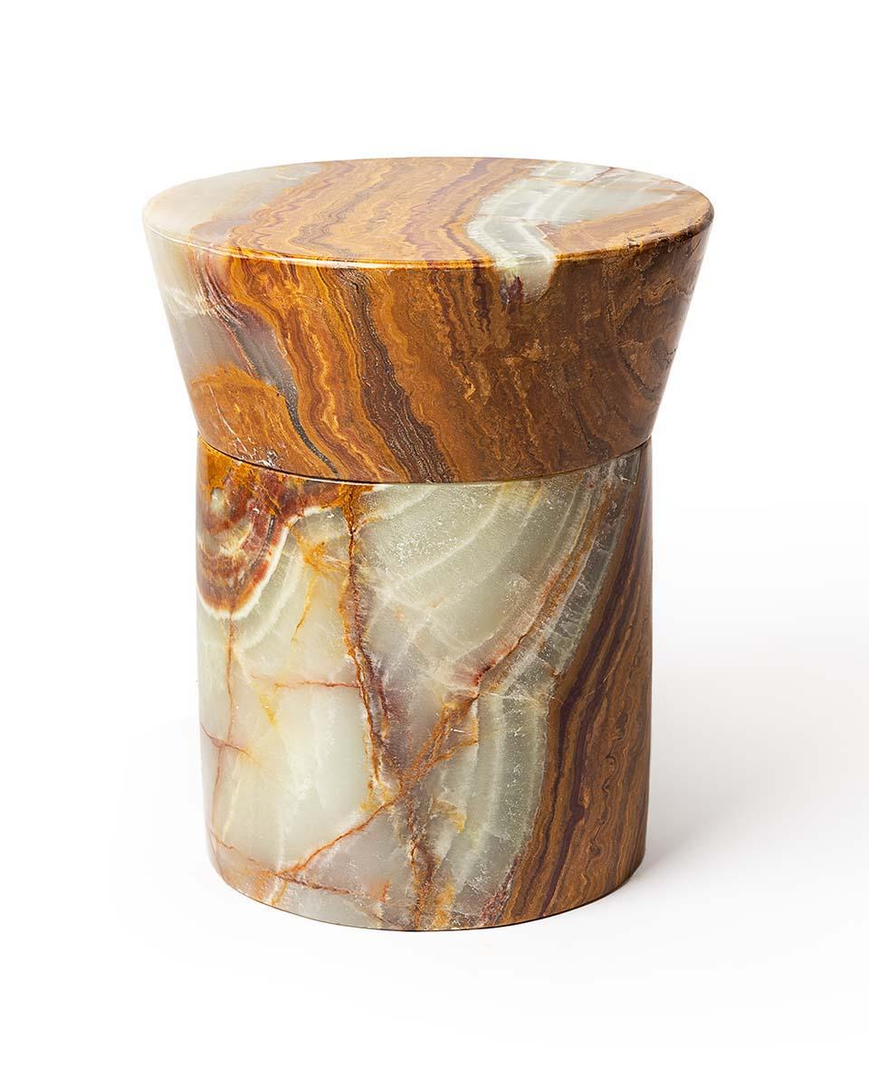 The Carved Stone Stool Series are combinations of either straight or tapered capitals and bases. Shape 2 is the second in the series of 4 shapes, with a tapered capital and straight base. Shown here in highly variegated Verde Onyx. Each stool is