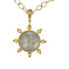 Carved "Sun Face" Moonstone, Diamond & Yellow Sapphire Pendant in Gold & Silver