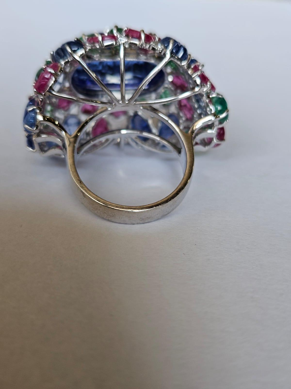 Art Deco Carved Tanzanite, Blue Sapphire, Emerald, Ruby & Dia Tutti Frutti Cocktail Ring For Sale