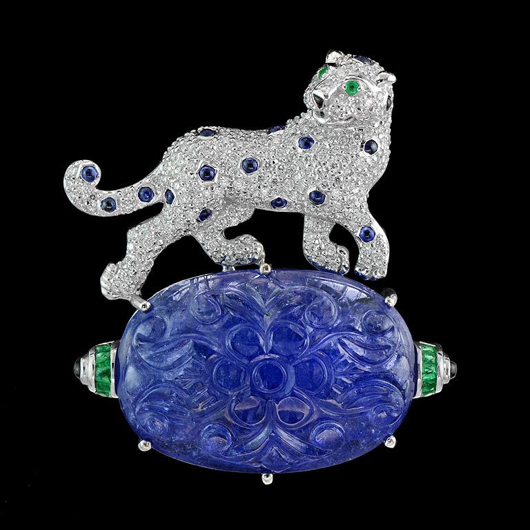 Panther Brooch was made in 18K White Gold with a good combination of stones.

Very fine lifelike detailing, set with Diamonds (round 1.1-1.2 mm. 193 pcs. 1.37 ct.), Blue Sapphire Spot (round 1.7 mm. 16 pcs. 0.45 ct.), Emerald eyes and stands on a