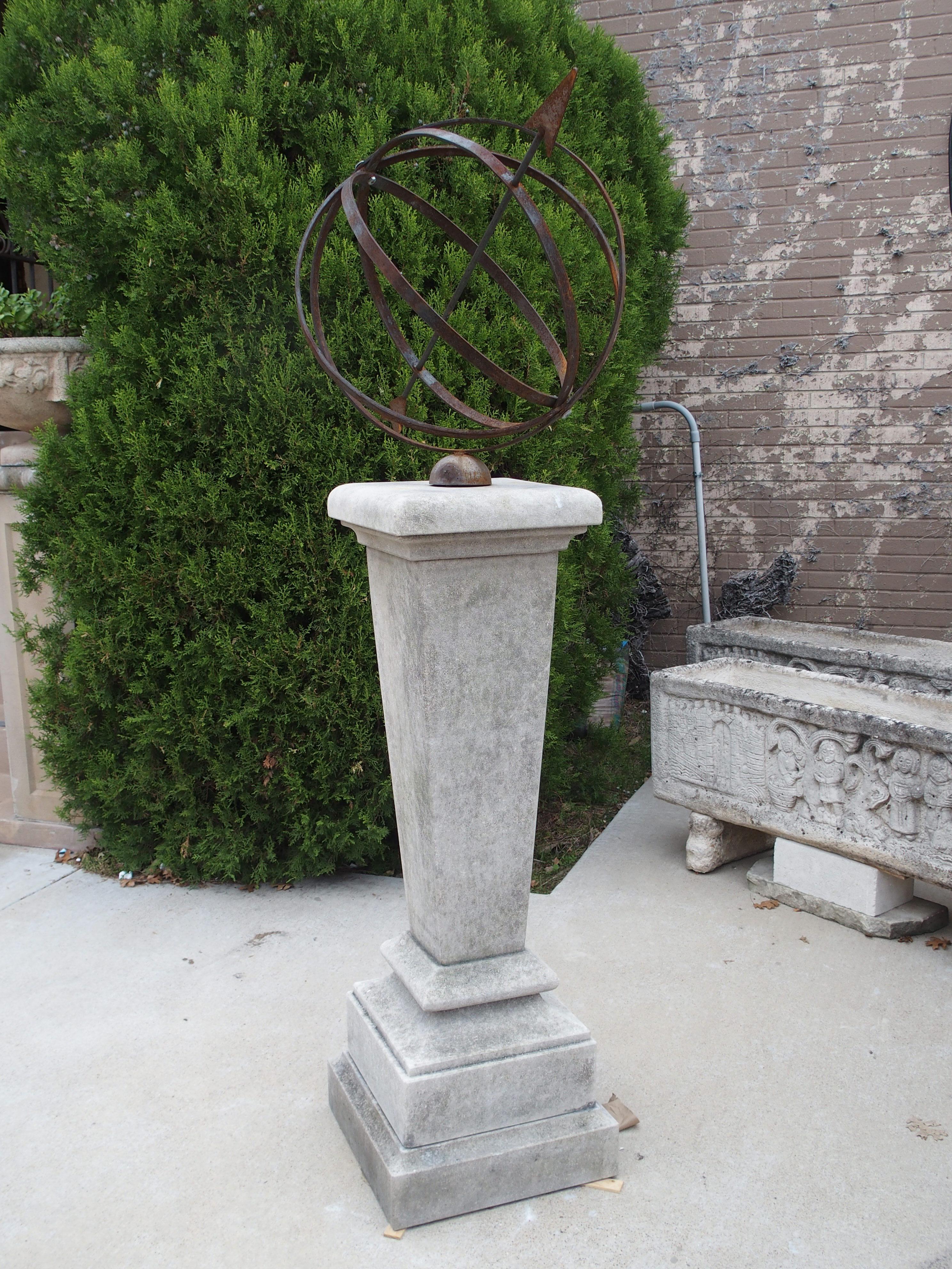 The tapering nature of the column adds a touch of elegance to this limestone armillary sundial. Hand-carved in Italy, the column is topped by a molded entablature that supports the four-ring iron armillary and arrow gnomon (the arrow is 37 ¼ inches