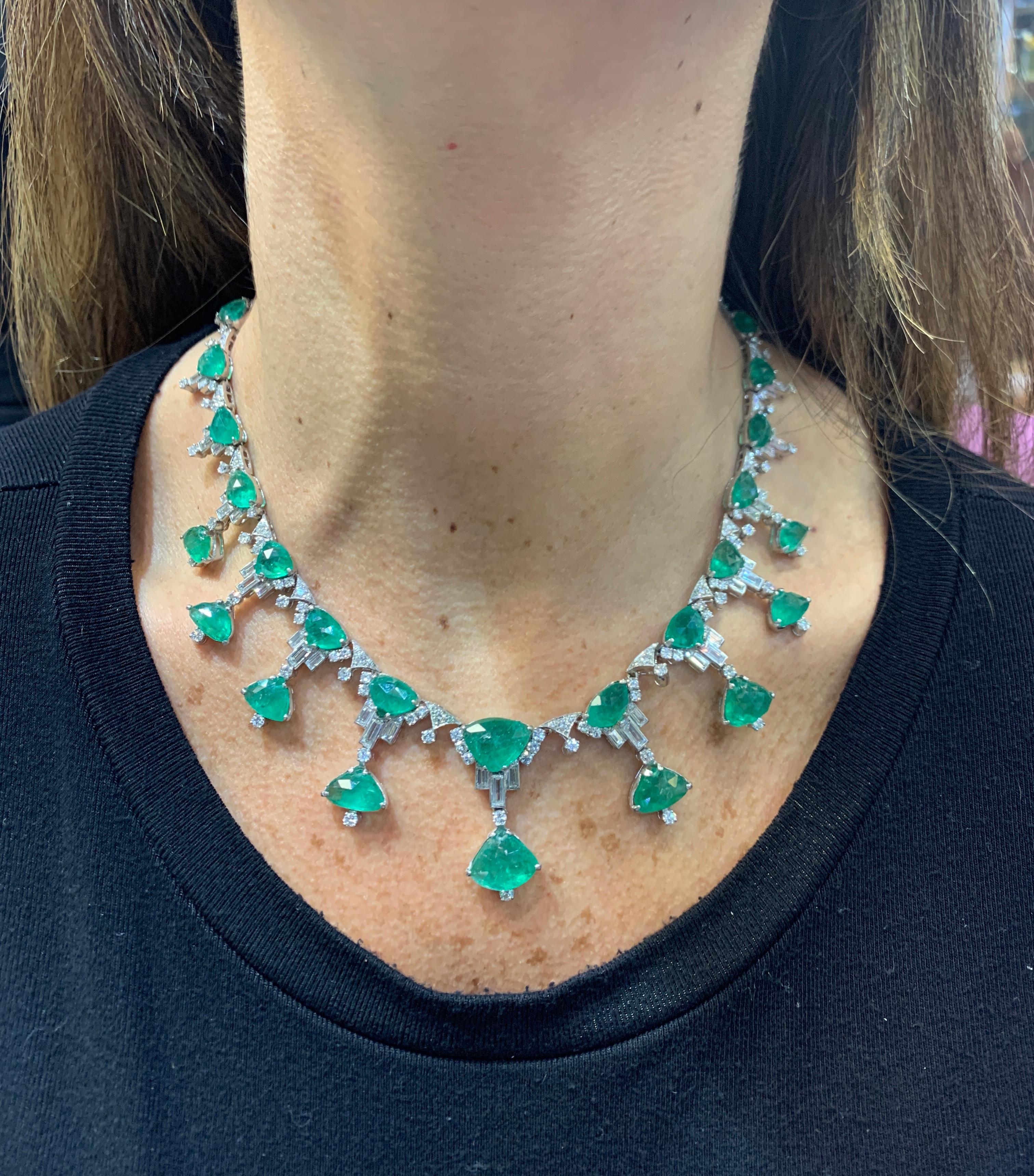 Carved Taveez Emerald and Diamond Necklace
34 Emeralds approximately 58.35 carats
42 Baguette Cut Diamonds and 224 Round Cut Diamonds approximately 6.02 carats
Measurements: 16
