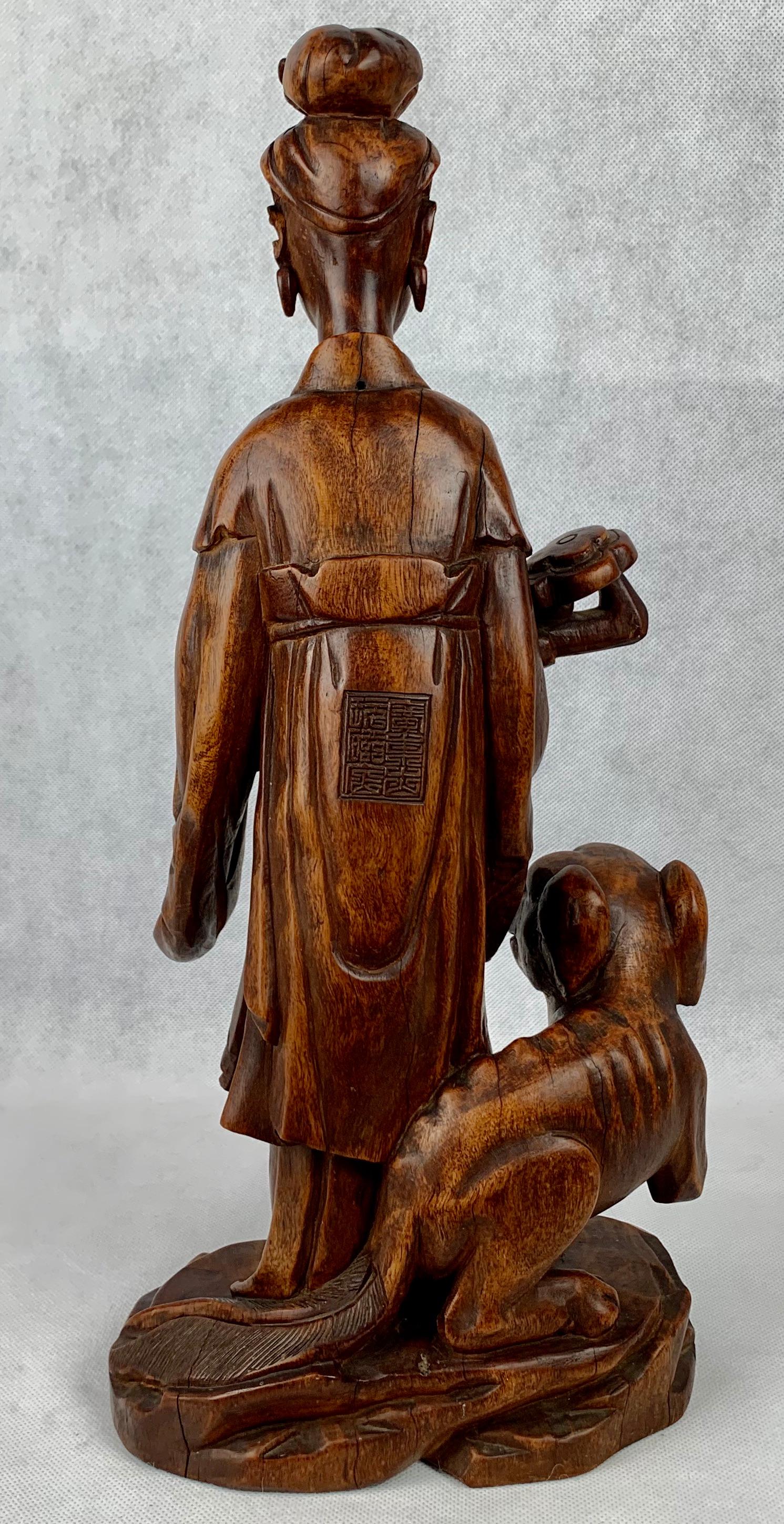 Hand-Carved Hand Carved Teak Chinese Figure Holding a Ruy For Sale