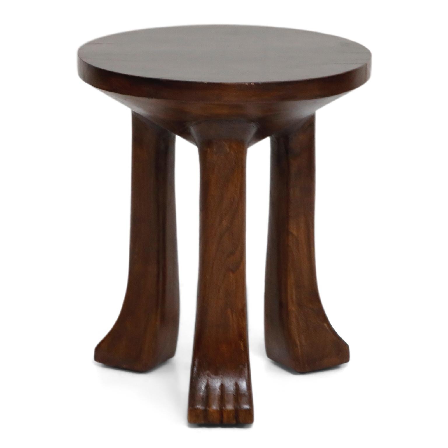 Tribal Carved Teak Three-Legged Lionfoot Stools in the Style of John Dickinson