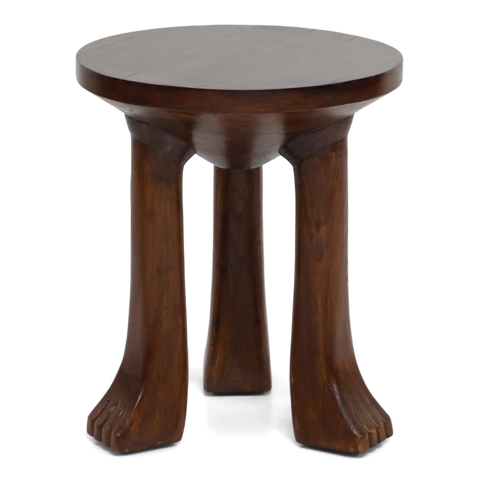 Carved Teak Three-Legged Lionfoot Stools in the Style of John Dickinson In Excellent Condition In Los Angeles, CA