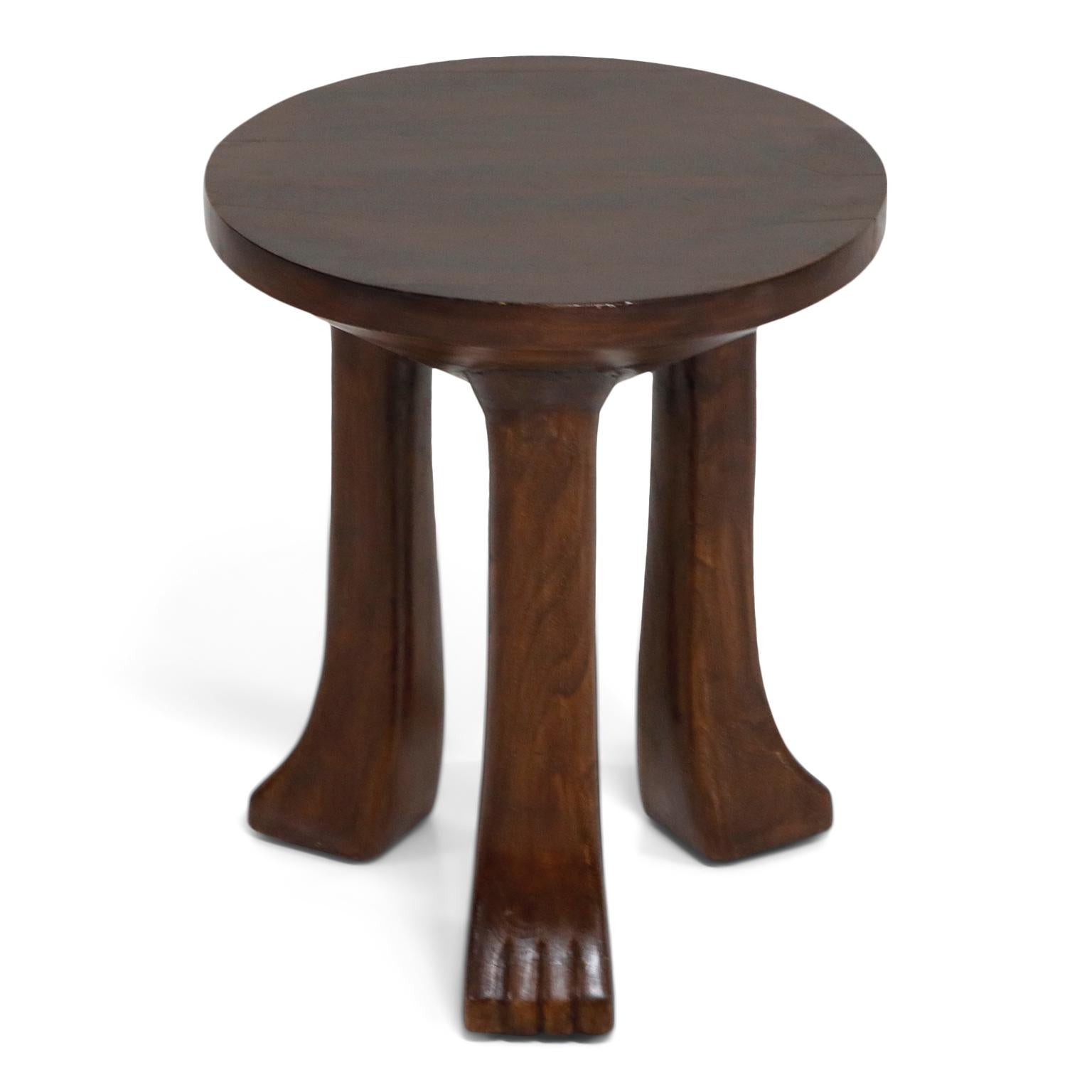 Carved Teak Three-Legged Lionfoot Stools in the Style of John Dickinson 1