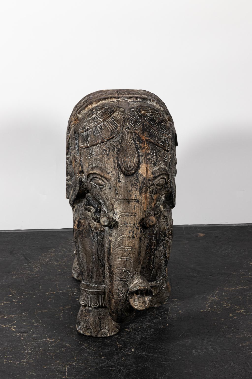 Carved teakwood elephant in a weathered finish. Please note of wear consistent with age.
