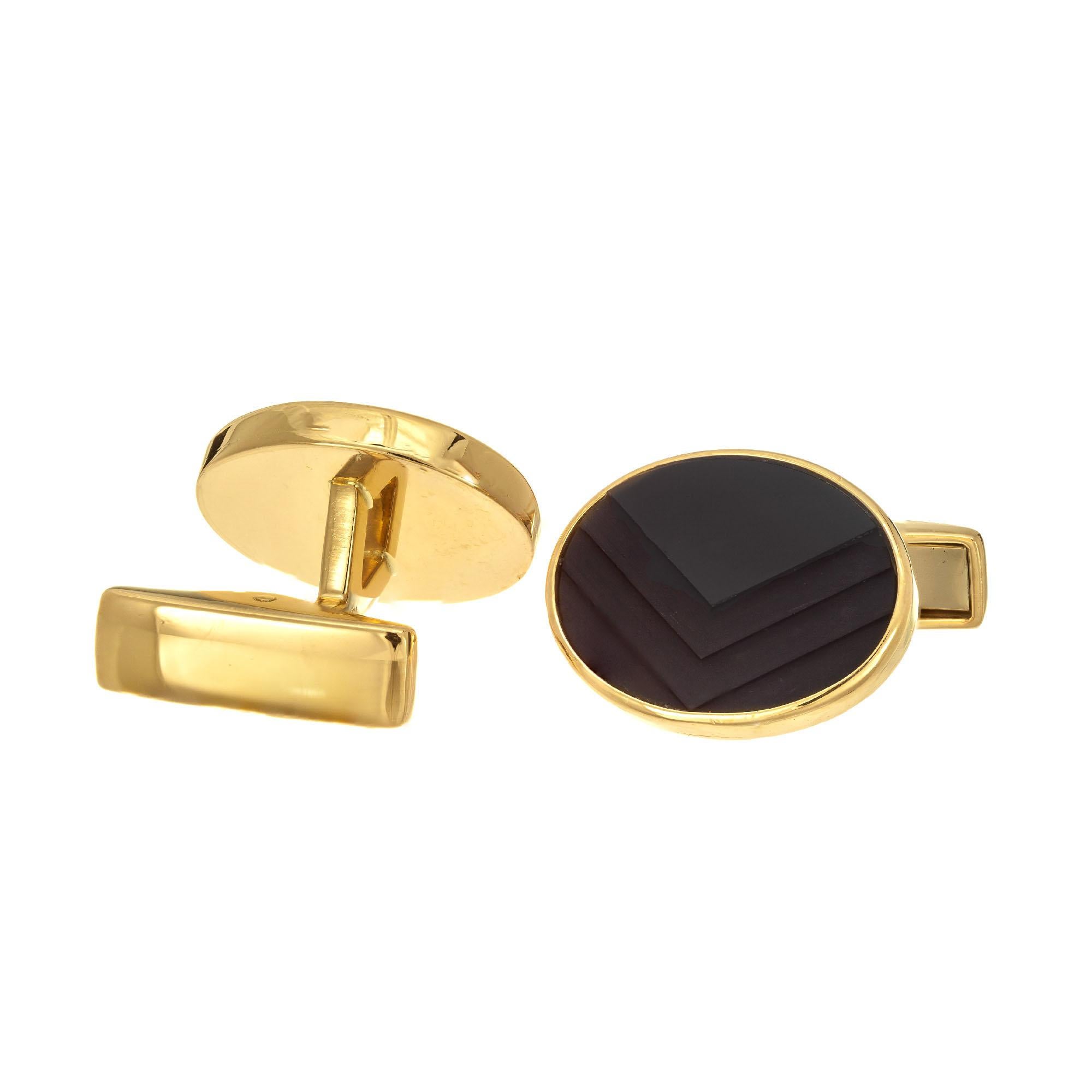 German carved chevron design textured 18k yellow gold cufflinks.

2 oval black chevron cut onyx
18k yellow gold 
Stamped: 18k Germany
13.8 grams 
Top to bottom: 14.5mm or 9/16 Inch
Width: 17.9mm or 5/8 Inch
Depth or thickness: 3.46mm
