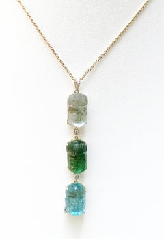 Carved Tourmaline with Diamond Buddha Pendant Set in 18 Karat Gold Settings