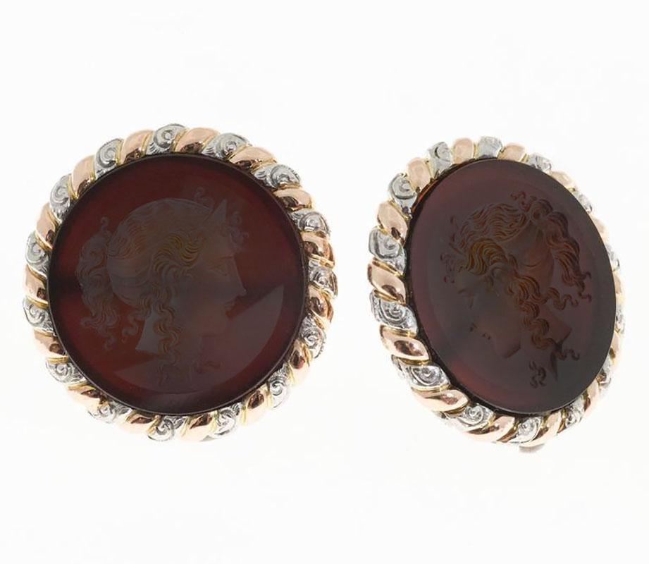 1940's Original Carnelian 14k Rose gold and Platinum earrings. Woman's profile Intaglio carvings with 14 rose gold and platinum swirl halos. Clip post earrings. 

2 round Carnelian Intaglio hand carved.
14k Rose Gold
Platinum
Tested: 14k
Platinum.