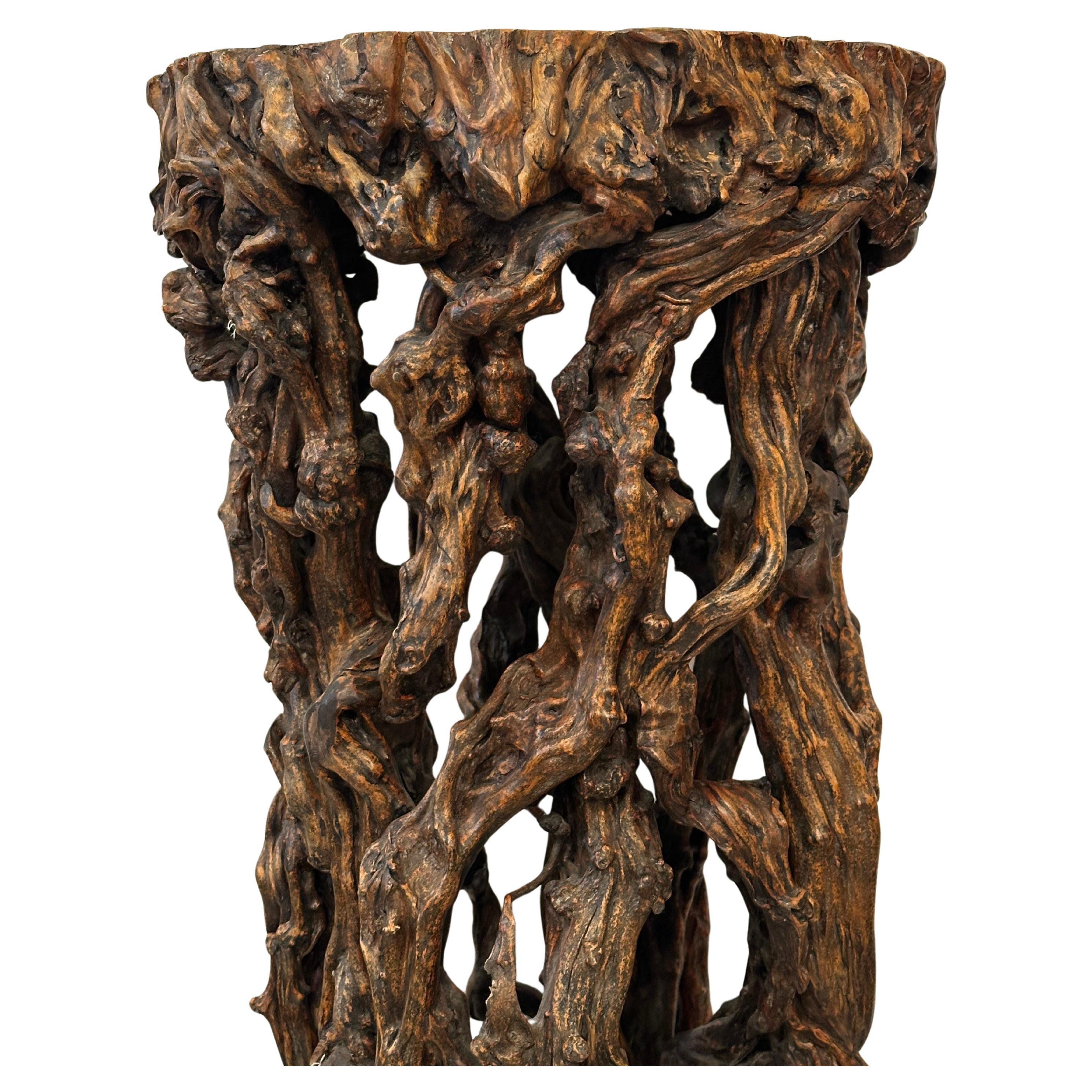 Hand-carved wooden tree root pedestal.  