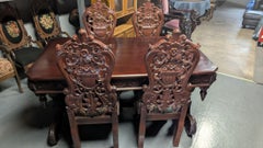 Carved Tressel Table and 4 Chairs