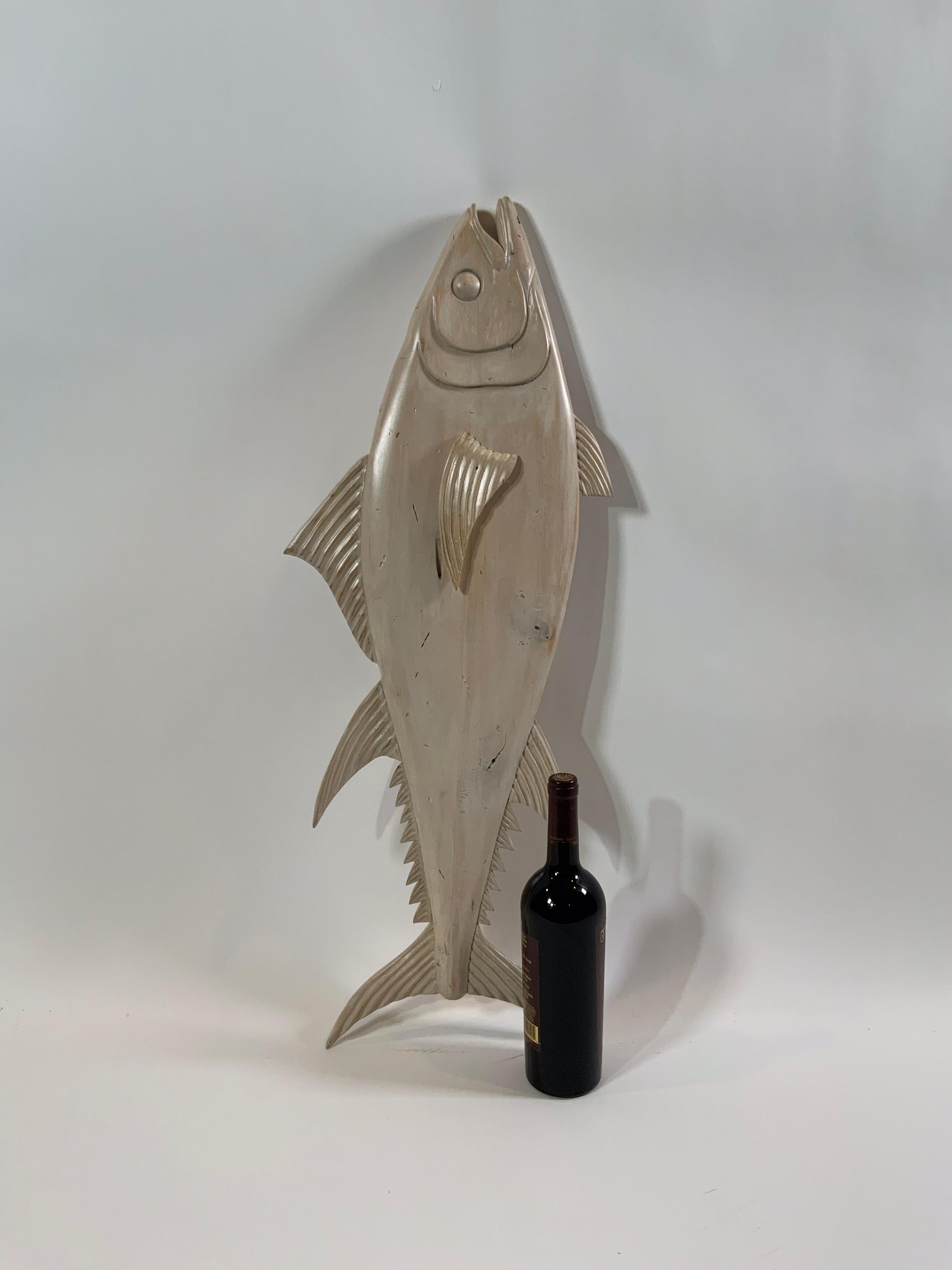 Hand carved hanging tuna fish. Awesome carved tuna with hand rubbed pickled finish. This finish is rubbed in through about a one hundred step process of stain, paint, sand finish, sand, repeat. The result is this fabulous hand carved and finished