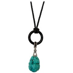 Carved Turquoise, Platinum, Diamond, Enamel and Onyx Art Deco Pendant