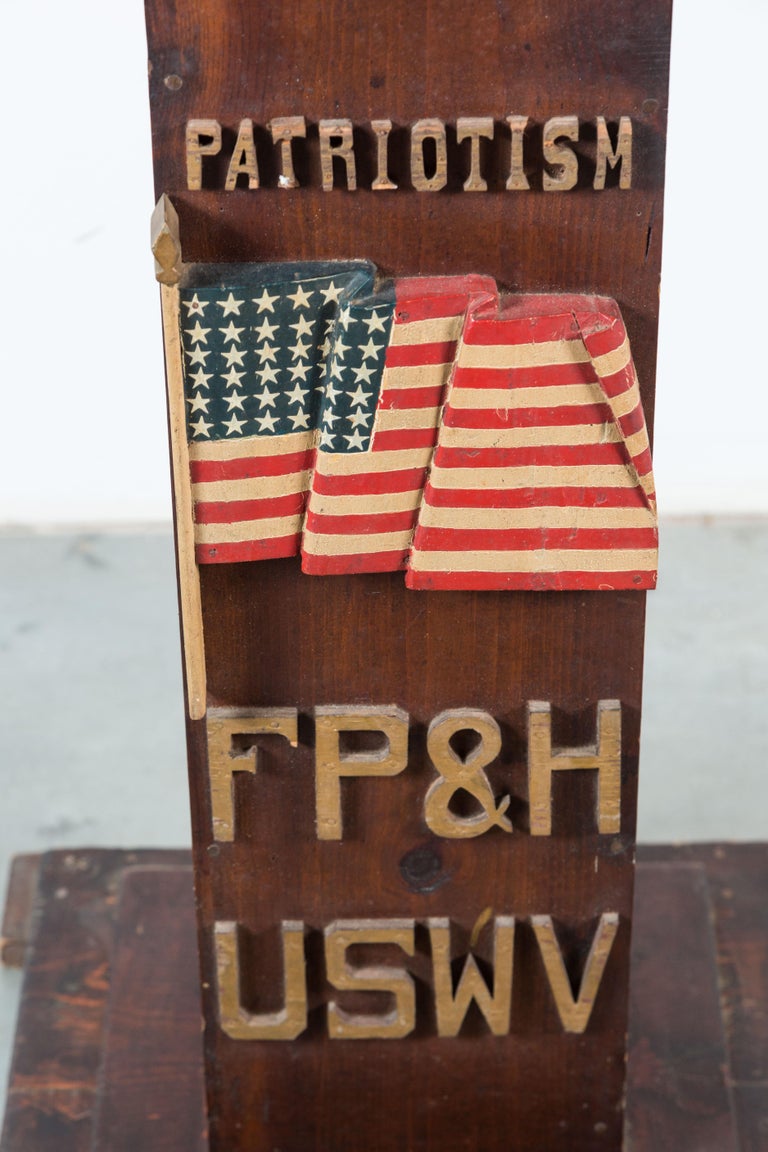Fantastic pair of ceremonial lodge pedestals from United Spanish War Veterans lodge in Toledo, Ohio. One with a very well carved and three dimensional American Flag marked Patriotism. The other has carved and clasped hands marked Friendship and
