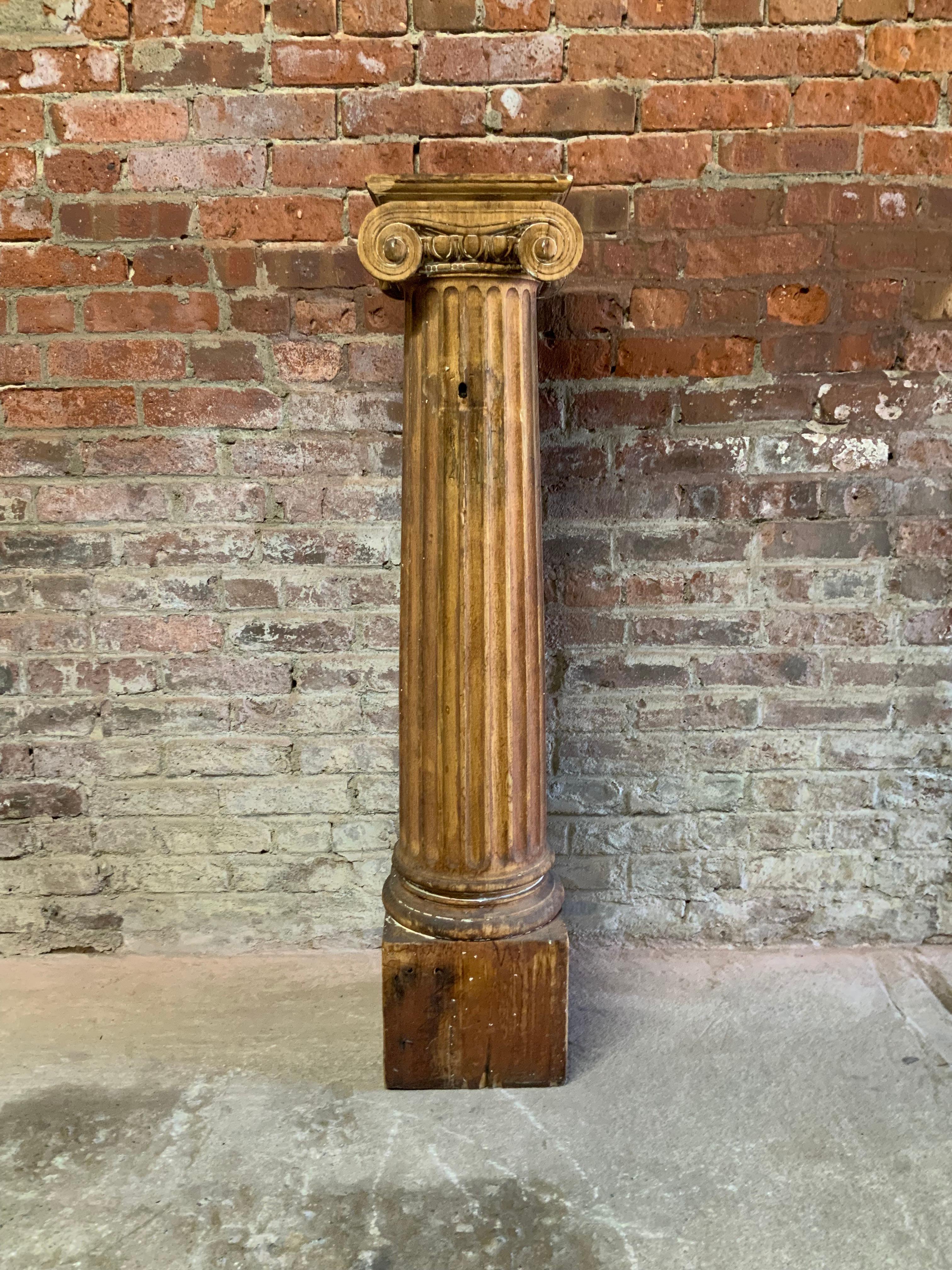Carved wood Ionic column. An architectural element from a former Rockland County, NY Victorian mansion. Original white paint has been stripped. This piece, due to its size, makes an excellent pedestal. Structurally sound and sturdy with remnants of