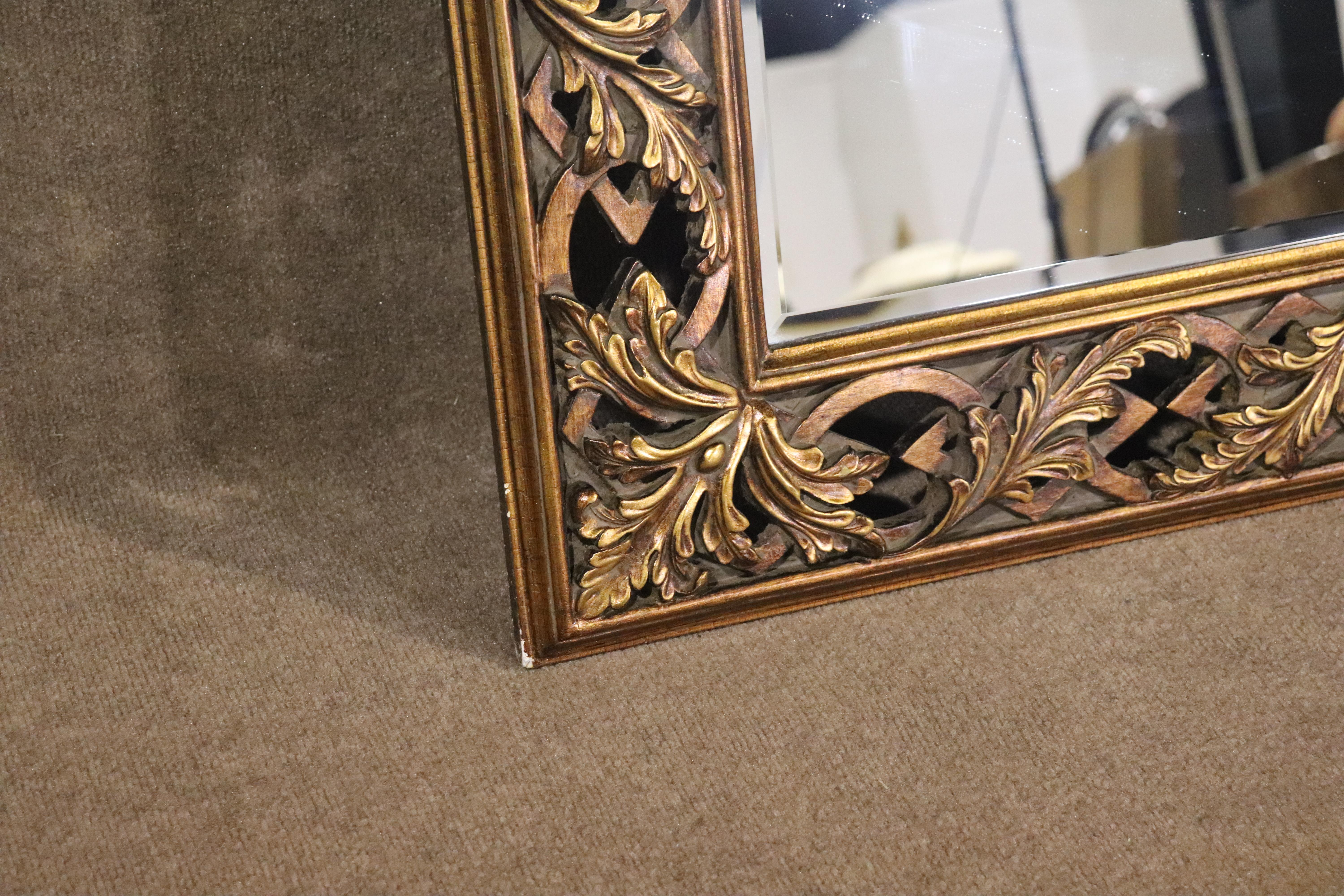 Large wall hanging mirror in a wide carved frame. Mirror is wired to hang vertical or horizontally. 
Please confirm location NY or NJ