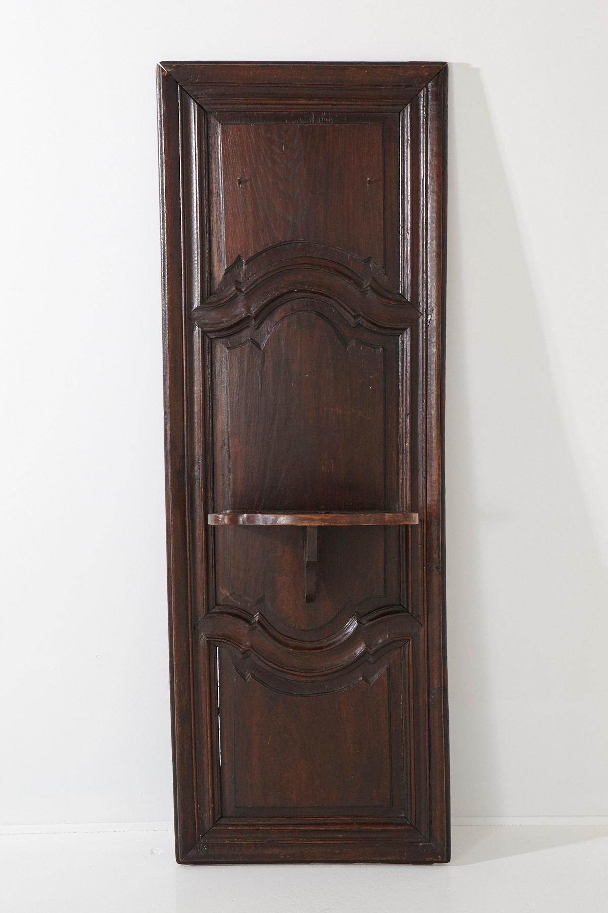 Carved wall panel with integrated shelf bracket, early 19th century.
There is a plentitude of possibilities, as a standalone object leaning against a wall or upright fixed on the wall, or some functional usage in an entrance hall, etc.
A lovely
