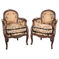 Carved Walnut and Needlepoint Upholstered French Louis XVI Bergère Chairs C1920s