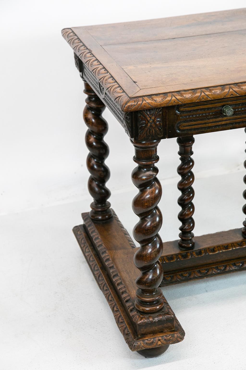 Carved walnut barley twist center table, the spindle cross stretcher with carved egg and dart moldings. All four sides have a carved leaf pattern with a center medallion.