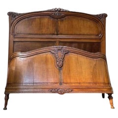 Carved walnut basket bed, Louis XVI style