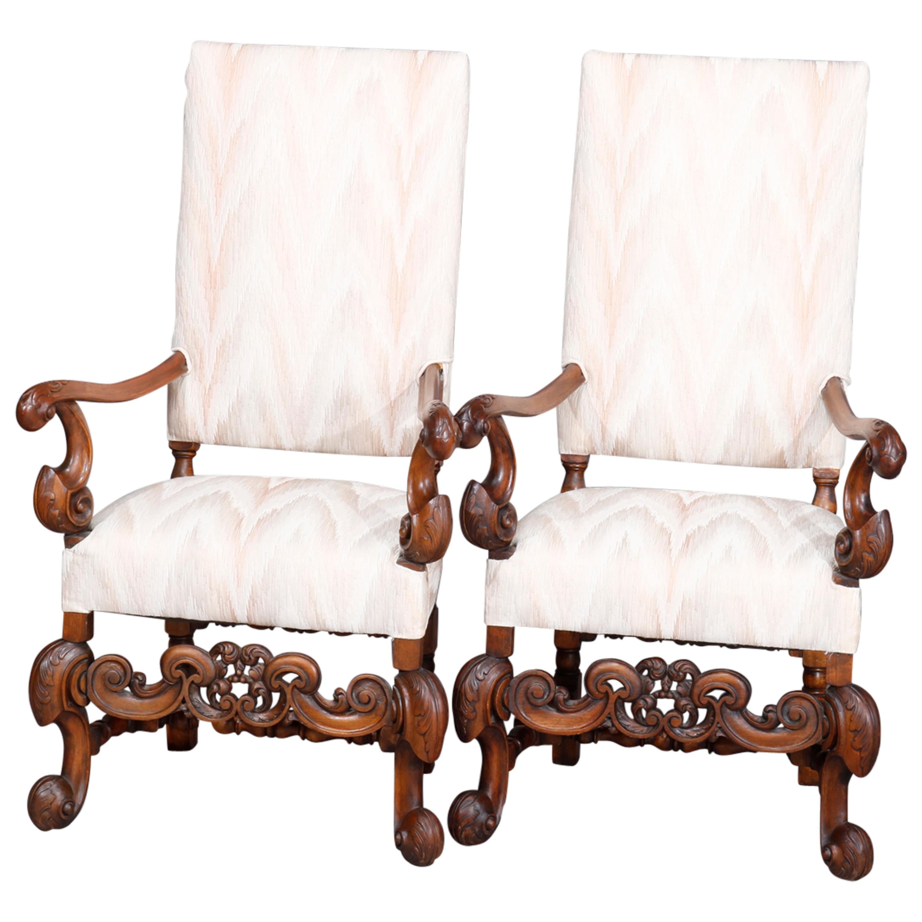 Carved Walnut Continental Baroque Upholstered Tall Fireside Chairs, circa 1910