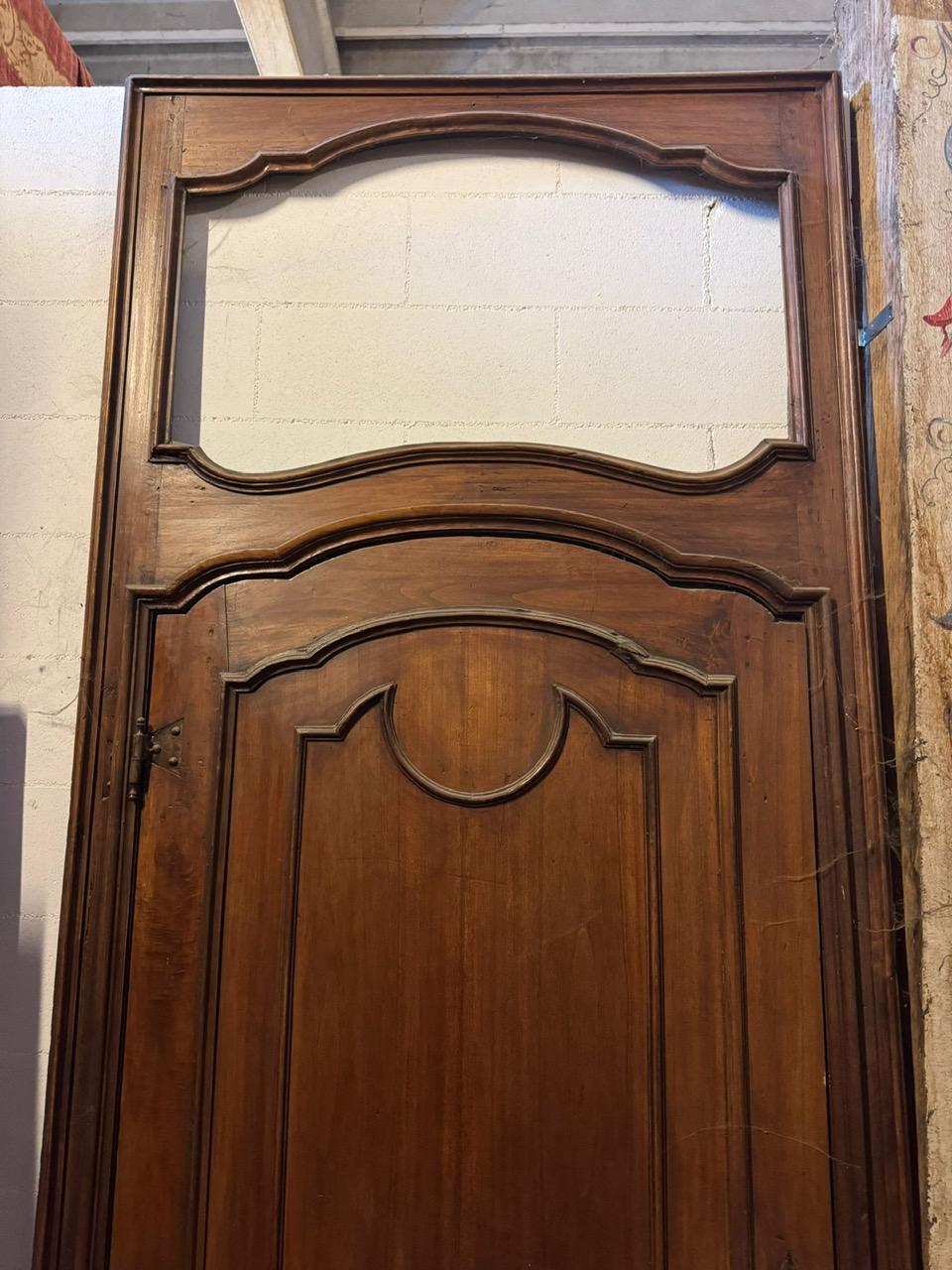 Italian Carved walnut door with a tall frame and space for an overdoor, Italy For Sale