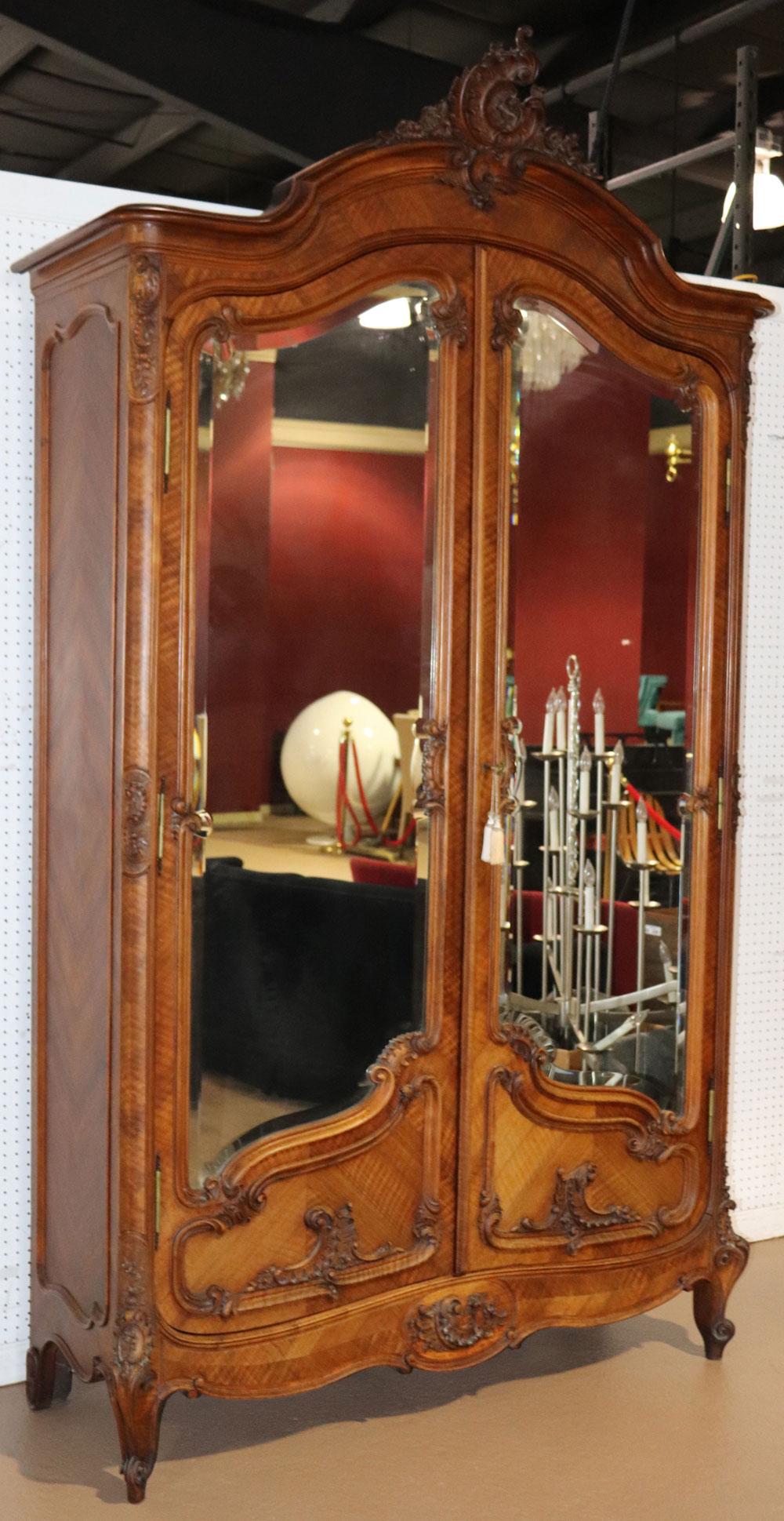 This is a gorgeous antique French armoire. The armoire has two mirrored doors and does have drawers and shelves. The mirrors are in good condition and the condition and has few flaws worthy of mentioning. The armoire measures 58 wide at the widest