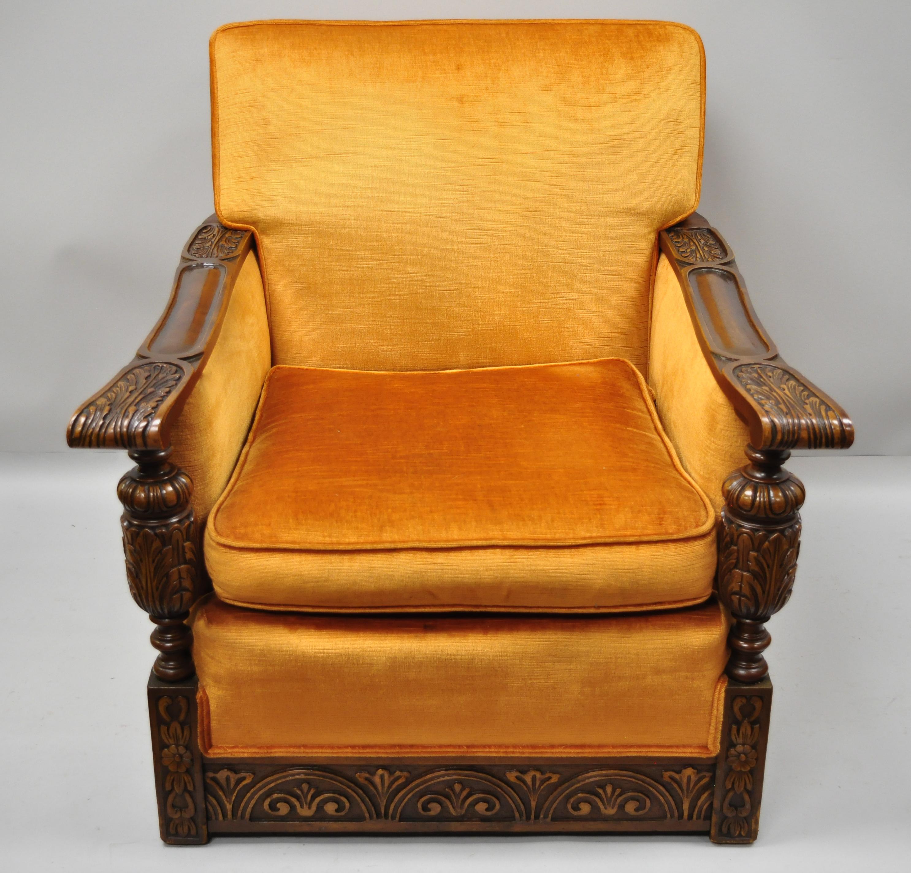 Item: Carved walnut club lounge chair with orange velvet fabric. Item features attractive orange velvet upholstery, nice comfortable form, solid wood construction, nicely carved details, a very nice antique item, circa 1930s. Measurements: 34