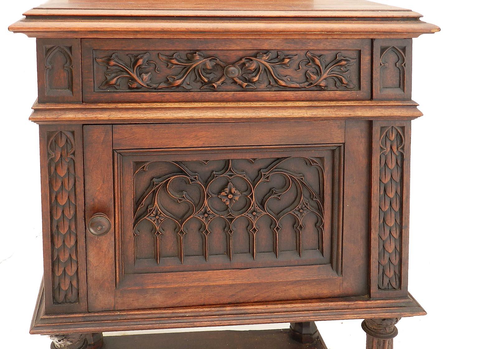 19th century Gothic Revival side cabinet French nightstand, circa 1860
Solid hand carved walnut
Single drawer
Cupboard door opens to variegated marble lined interior
Good antique condition with only minor signs of use for its age
Worthy of Harry