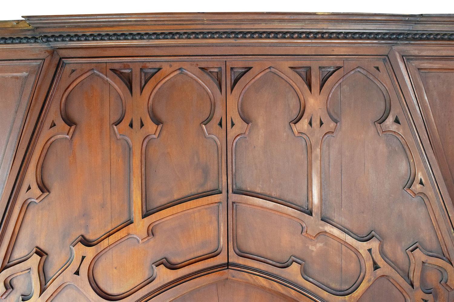 This massive over-mantel made from walnut is so rich and detailed with beauty. This mantel is from a mansion owned by Harmar Denny, which was built in 1895. There are magnificent carvings throughout the entire mantel. These designs flow from the top