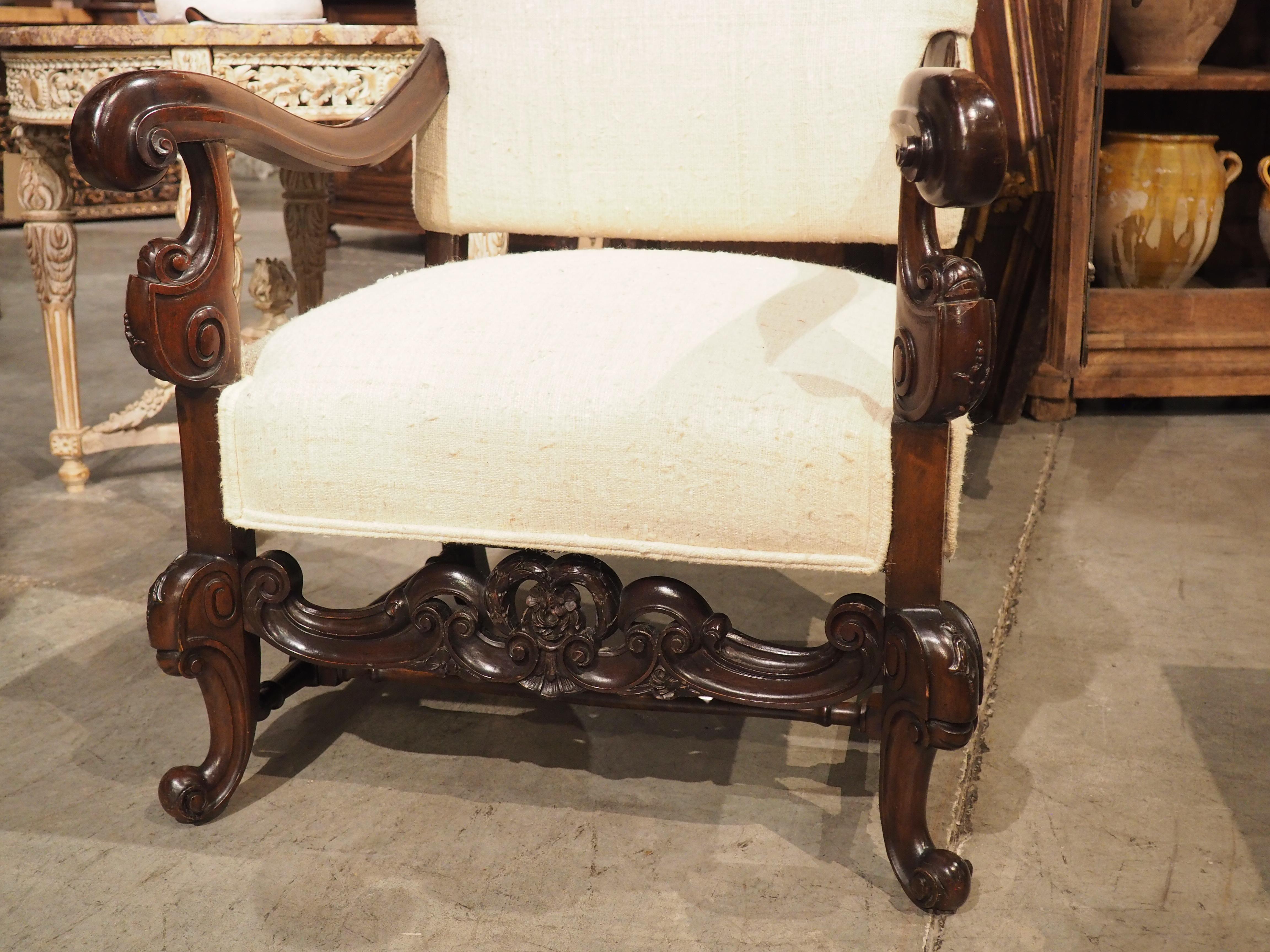 European Carved Walnut Wood Baroque Style Armchair with Raw Silk Upholstery, Mid 1900s For Sale