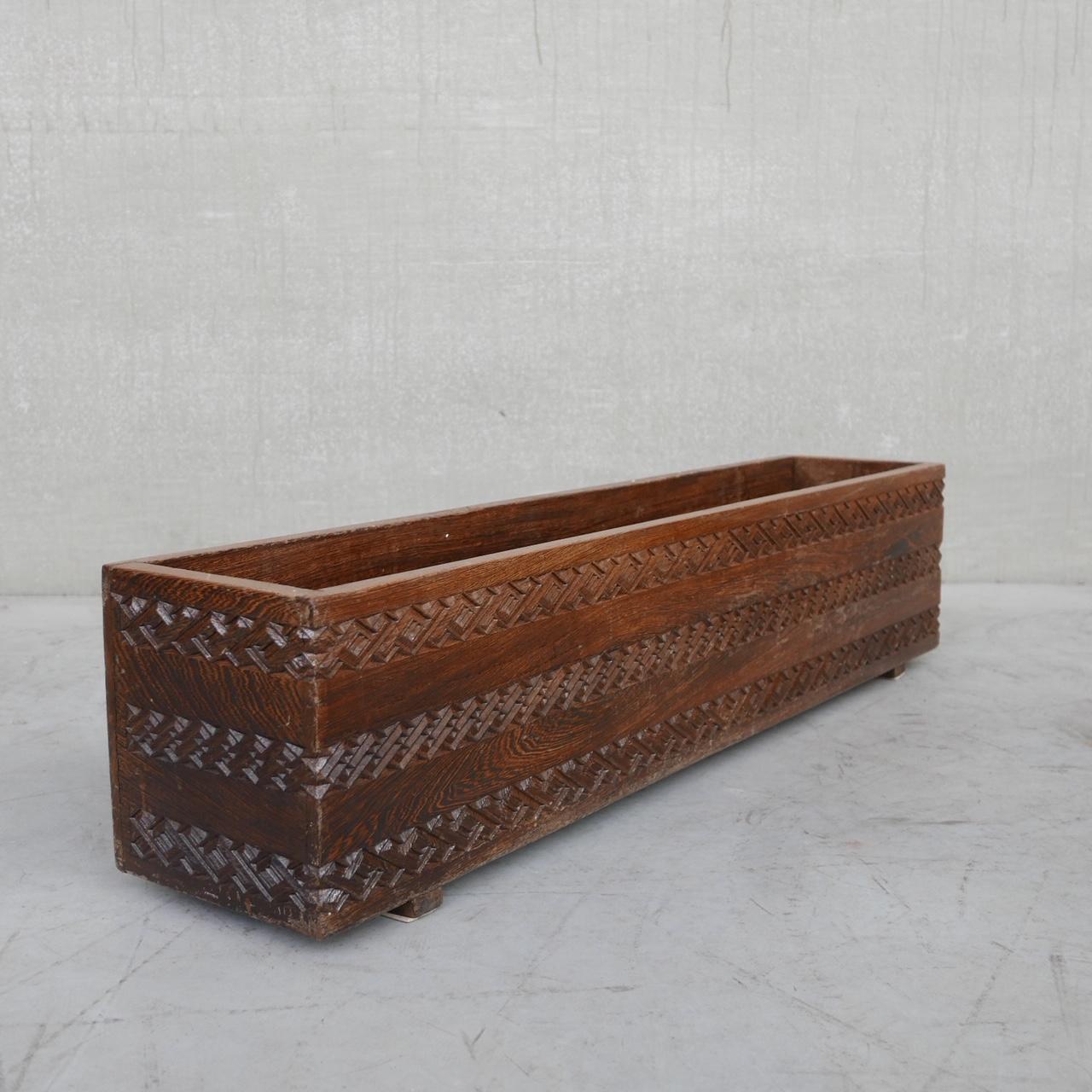 A carved wooden planter in wenge. 

Sourced from Belgium, likely was Congolese origin before their re-independance from colonialism. 

Congo, c1950s. 

Good condition. 

Carved to sides and front. 

Location: Belgium Gallery.