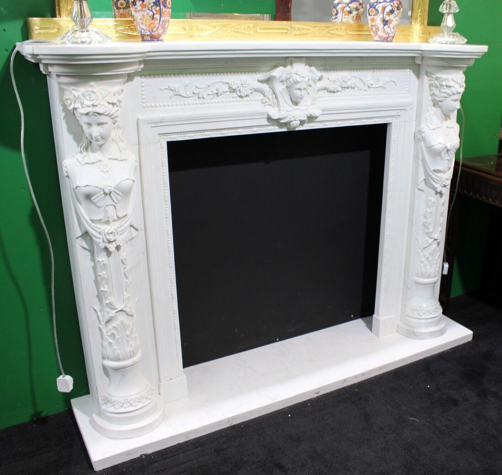 Carved White Marble Fireplace Surround with Caryatid Figures, Never Installed

An impressive and finely carved white marble fireplace surround, designed in classical style with caryatid figures and central mask ornament. Executed in crisp white