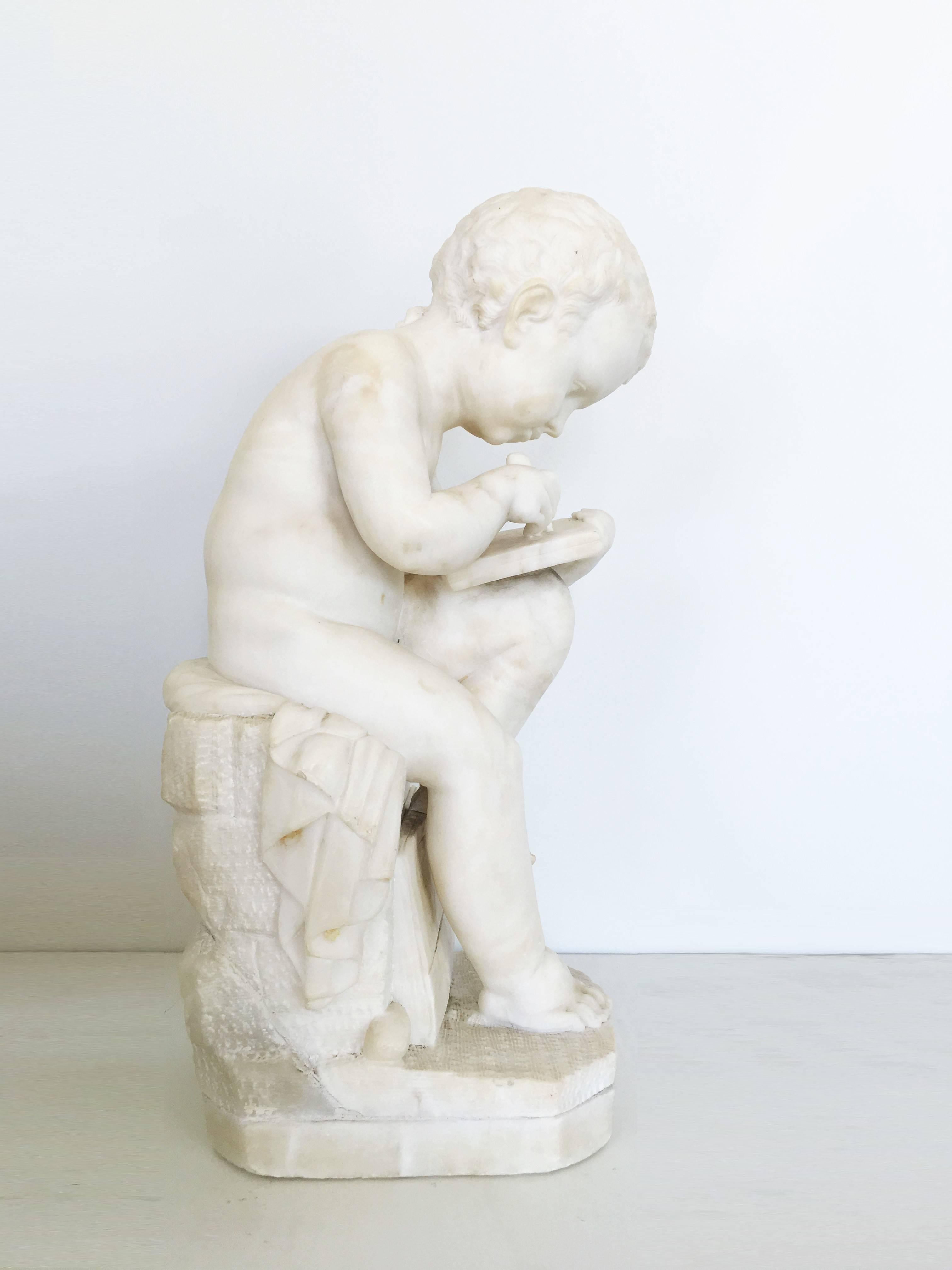 Carved White Marble Sculpture of a Child Writing For Sale 4