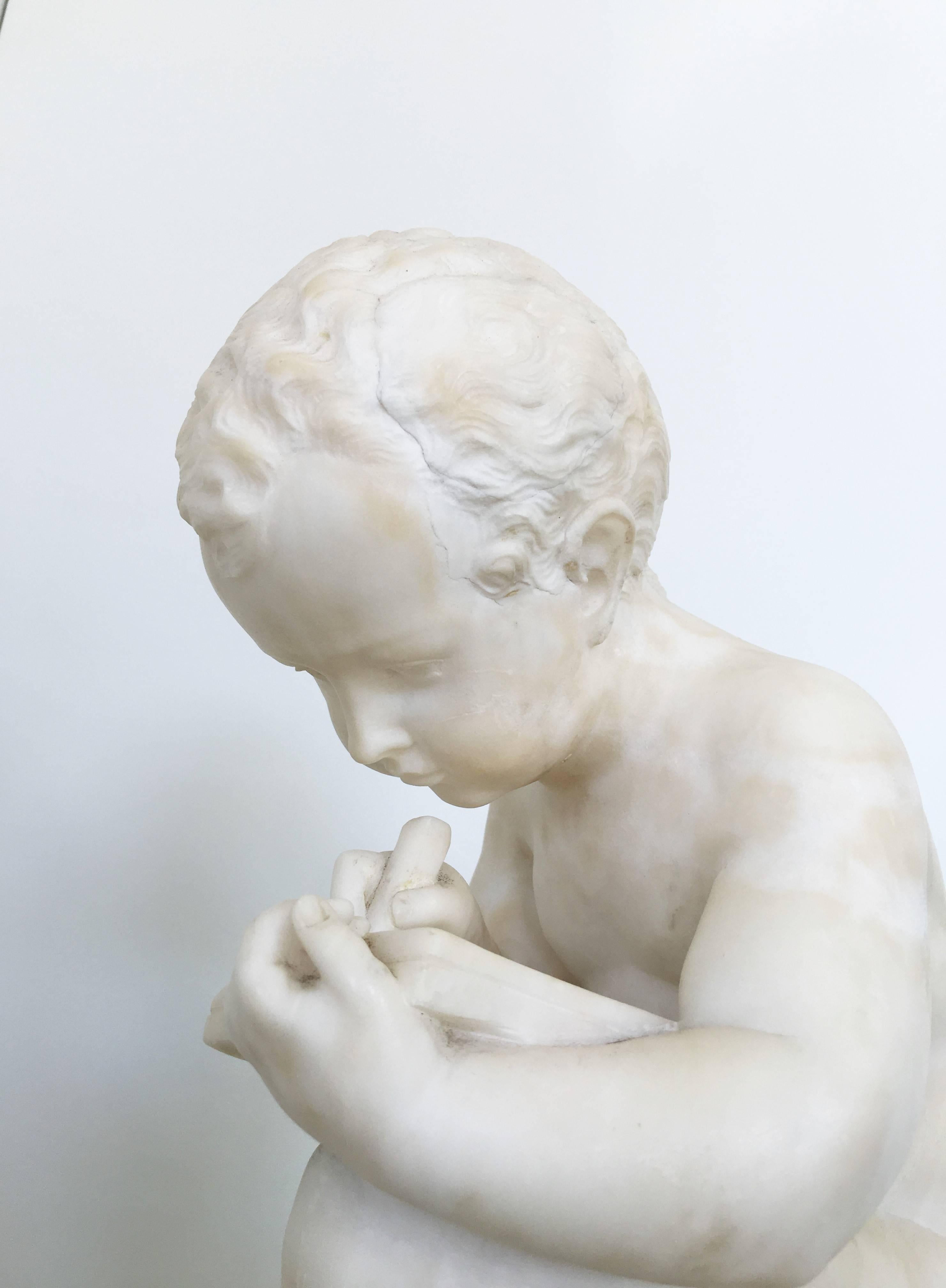 Carved White Marble Sculpture of a Child Writing For Sale 5