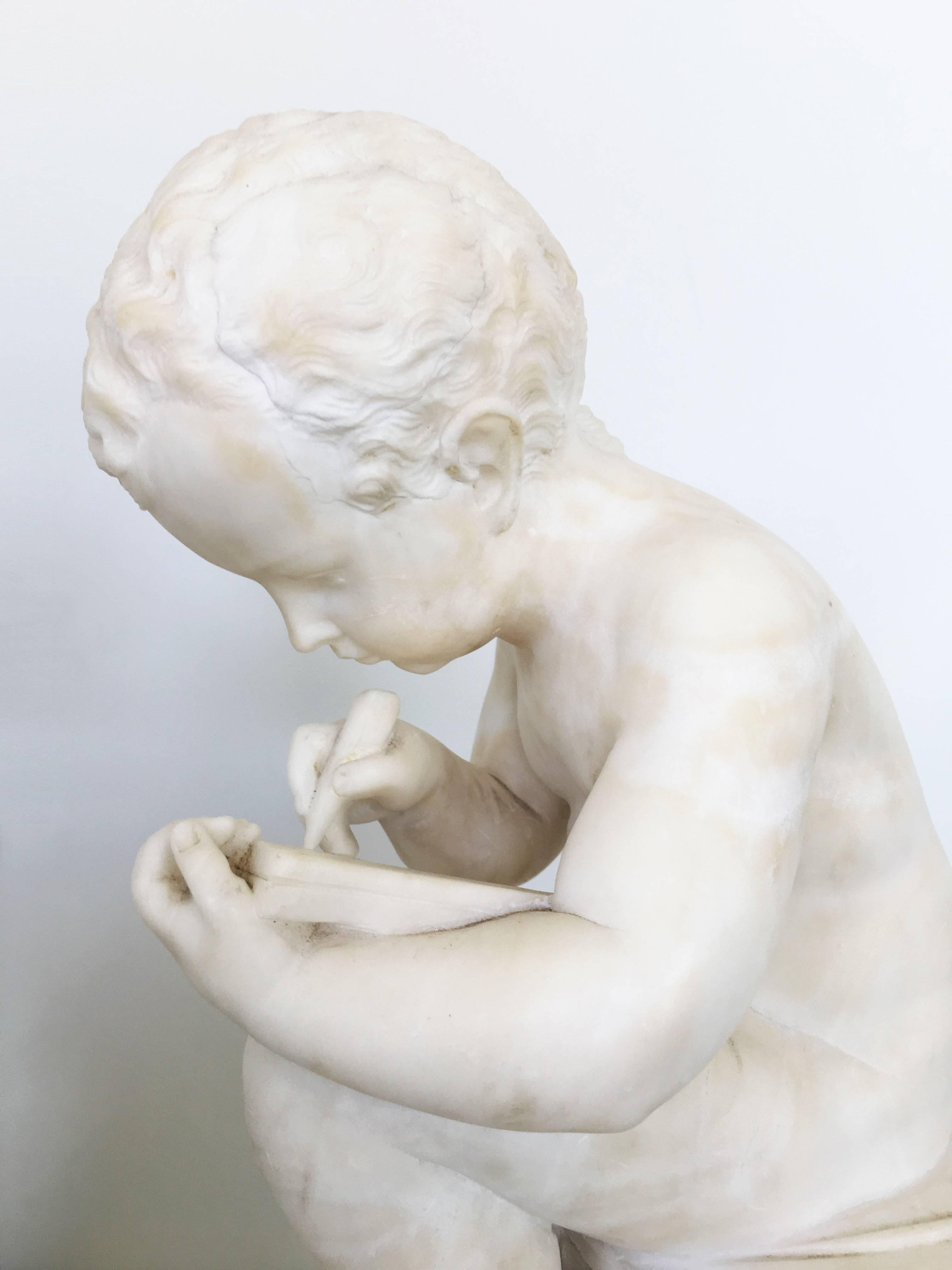 Carved White Marble Sculpture of a Child Writing For Sale 6
