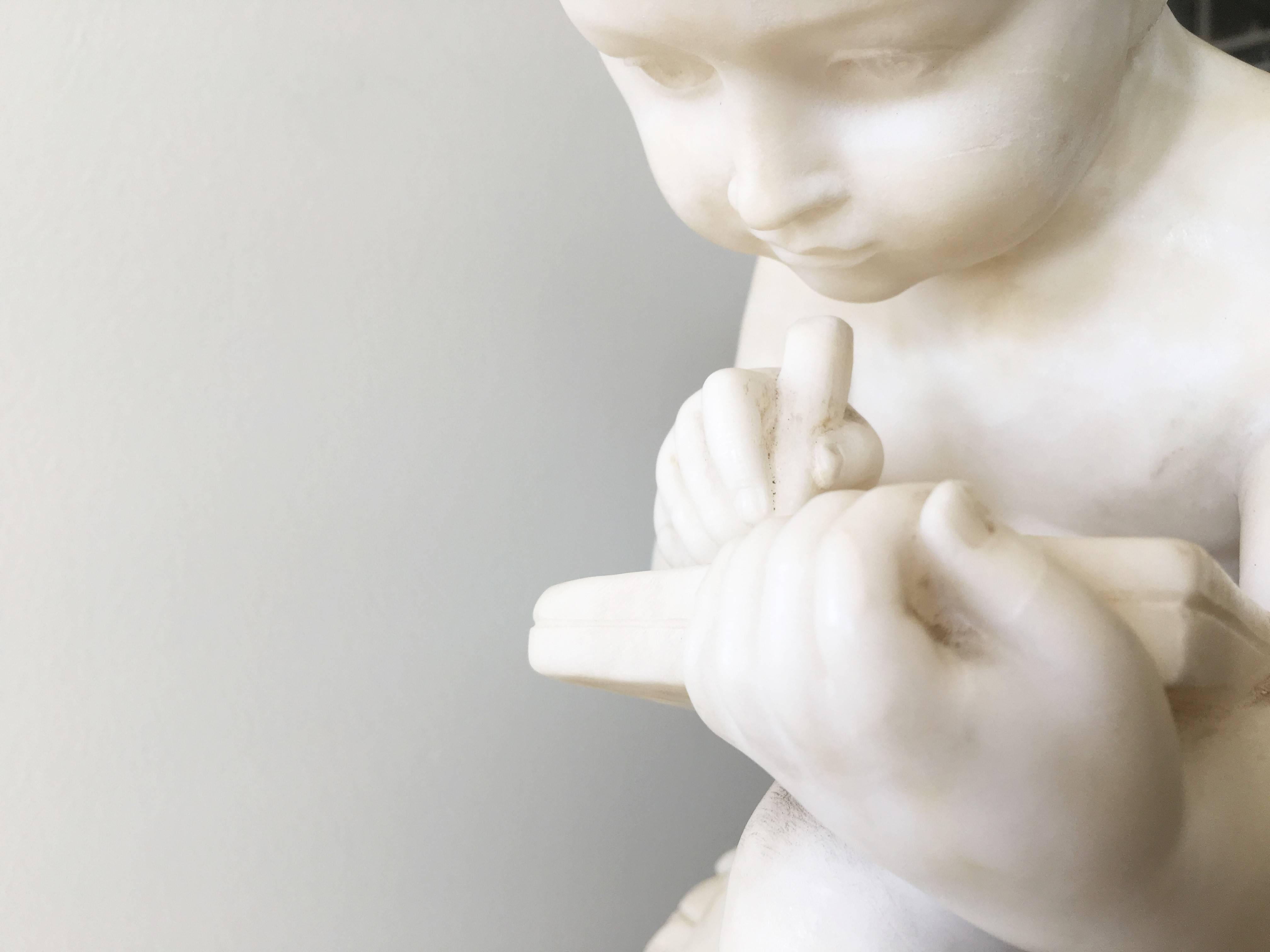 Carved White Marble Sculpture of a Child Writing In Good Condition For Sale In Dallas, TX