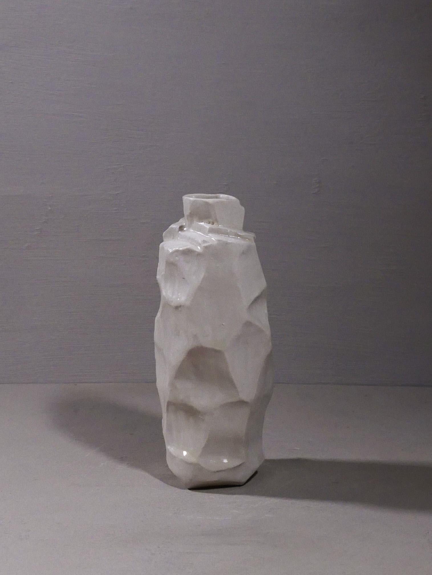 A white porcelain vase finished with matte white glaze by acclaimed artist Judith Solomon. 