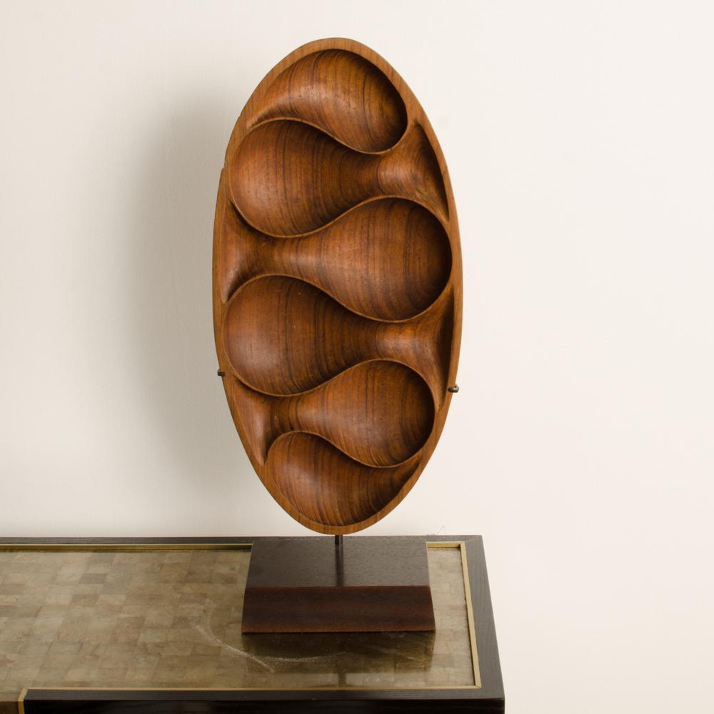 Carved Wood Almond Shaped Sculpture and Base In Good Condition For Sale In Philadelphia, PA