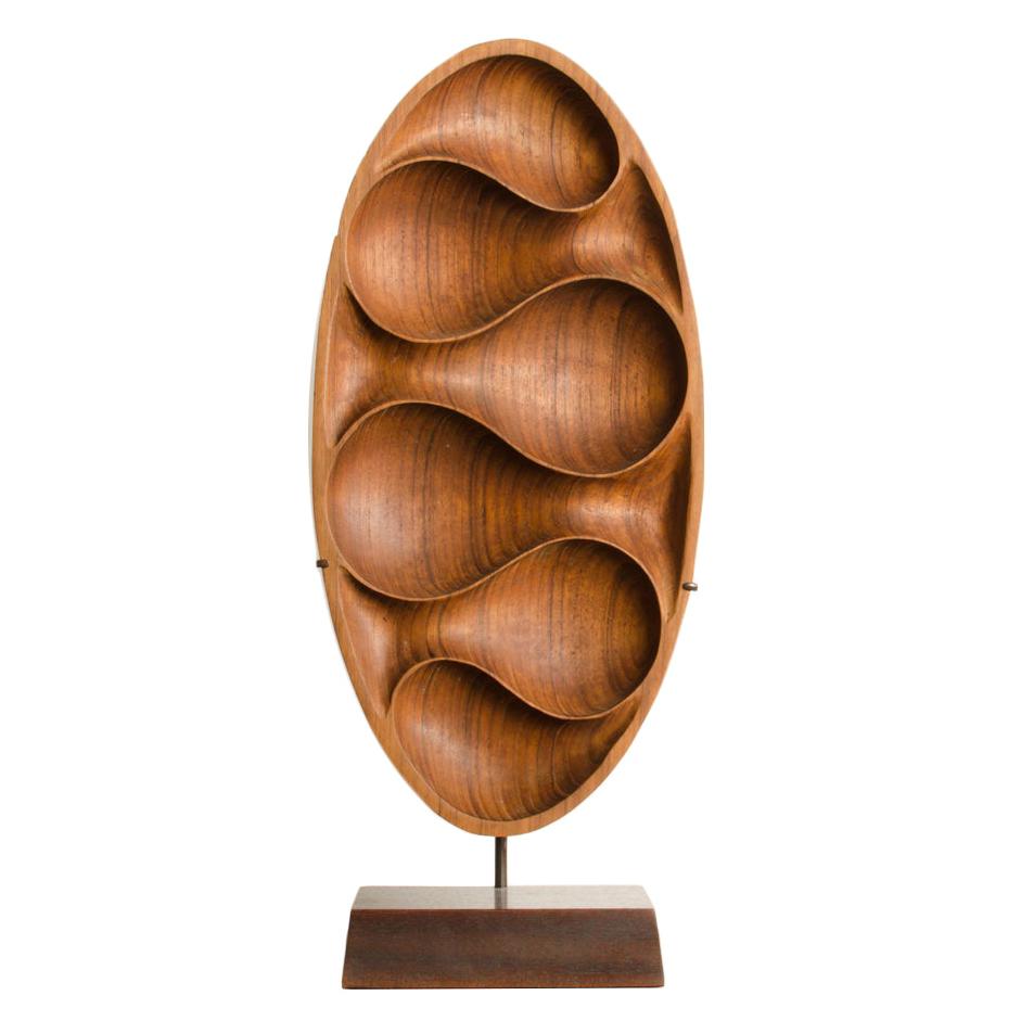 Carved Wood Almond Shaped Sculpture and Base For Sale