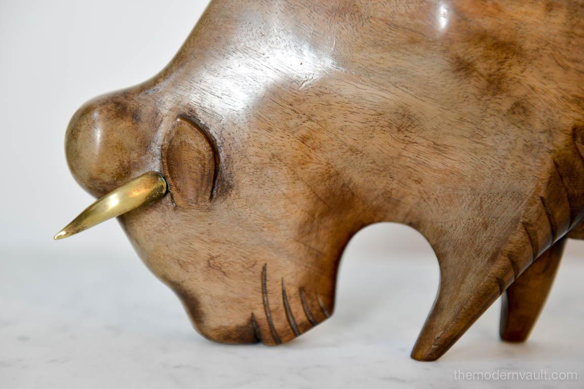 Carved Wood and Brass Bull by Franz Hagenauer, Austria, circa 1965. Made of fruitwood with brass horns. Previously repaired back leg, hardly noticeable.

Measures 12