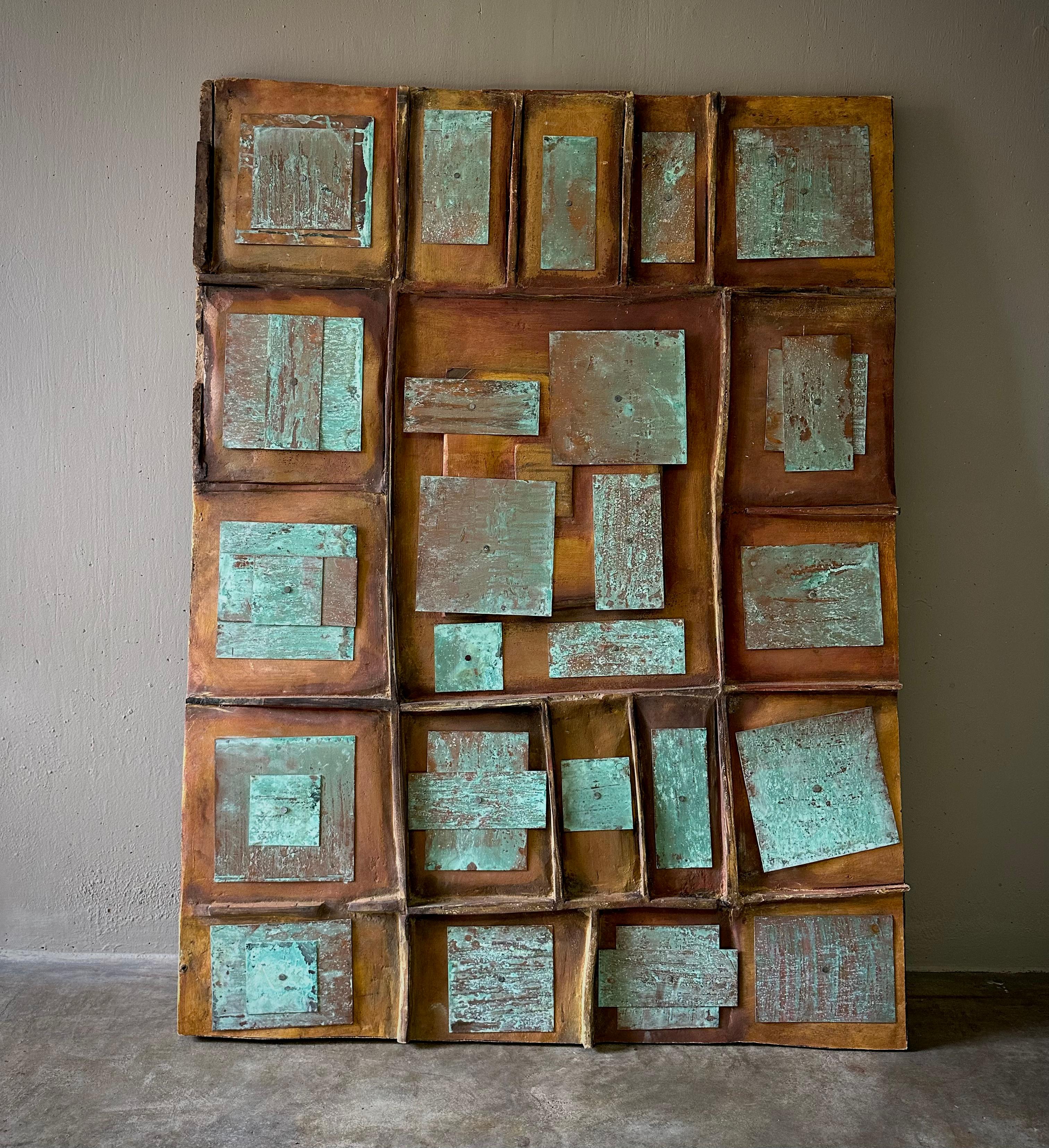Geometric carved wooden art panel with copper verdigris collage elements by anonymous artist. Bold and graphic but with a wonderfully tactile quality. 

France, circa 1970

Dimensions: 55 W x 2.5 D x 41 H.